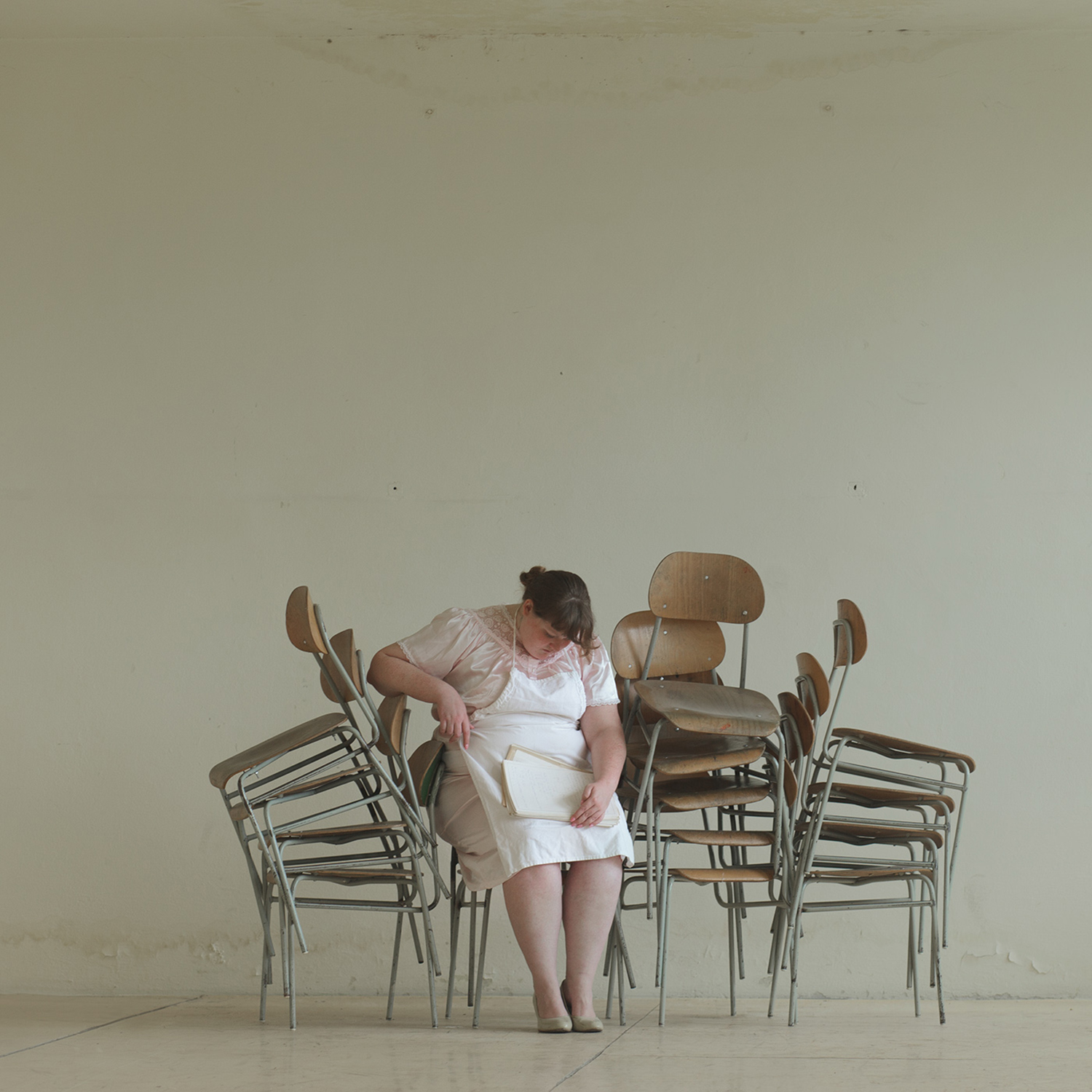 Evelyn Bencicova, School of Life - woman on stacked chairs