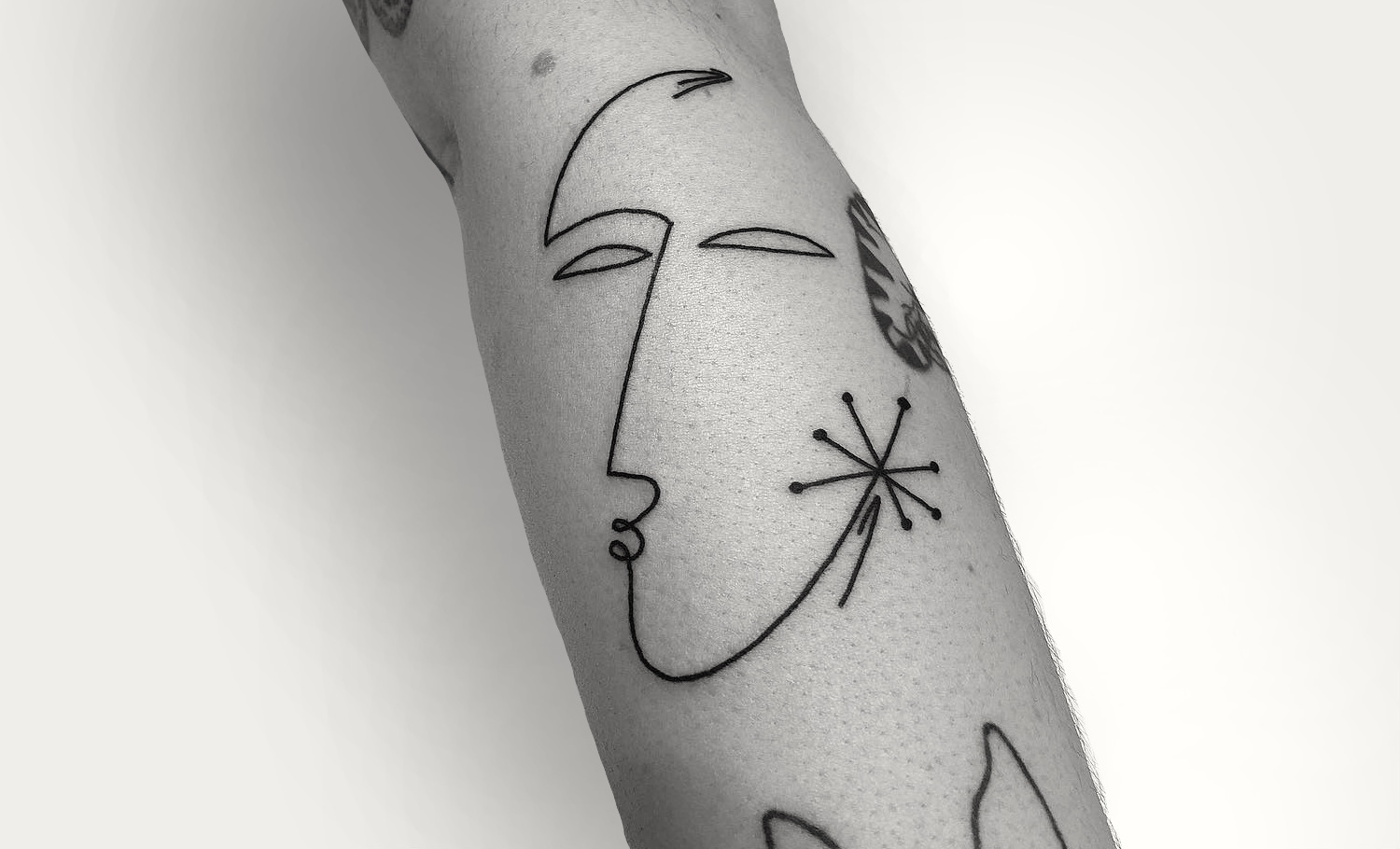 Single line tattoo by Caleb Kilby