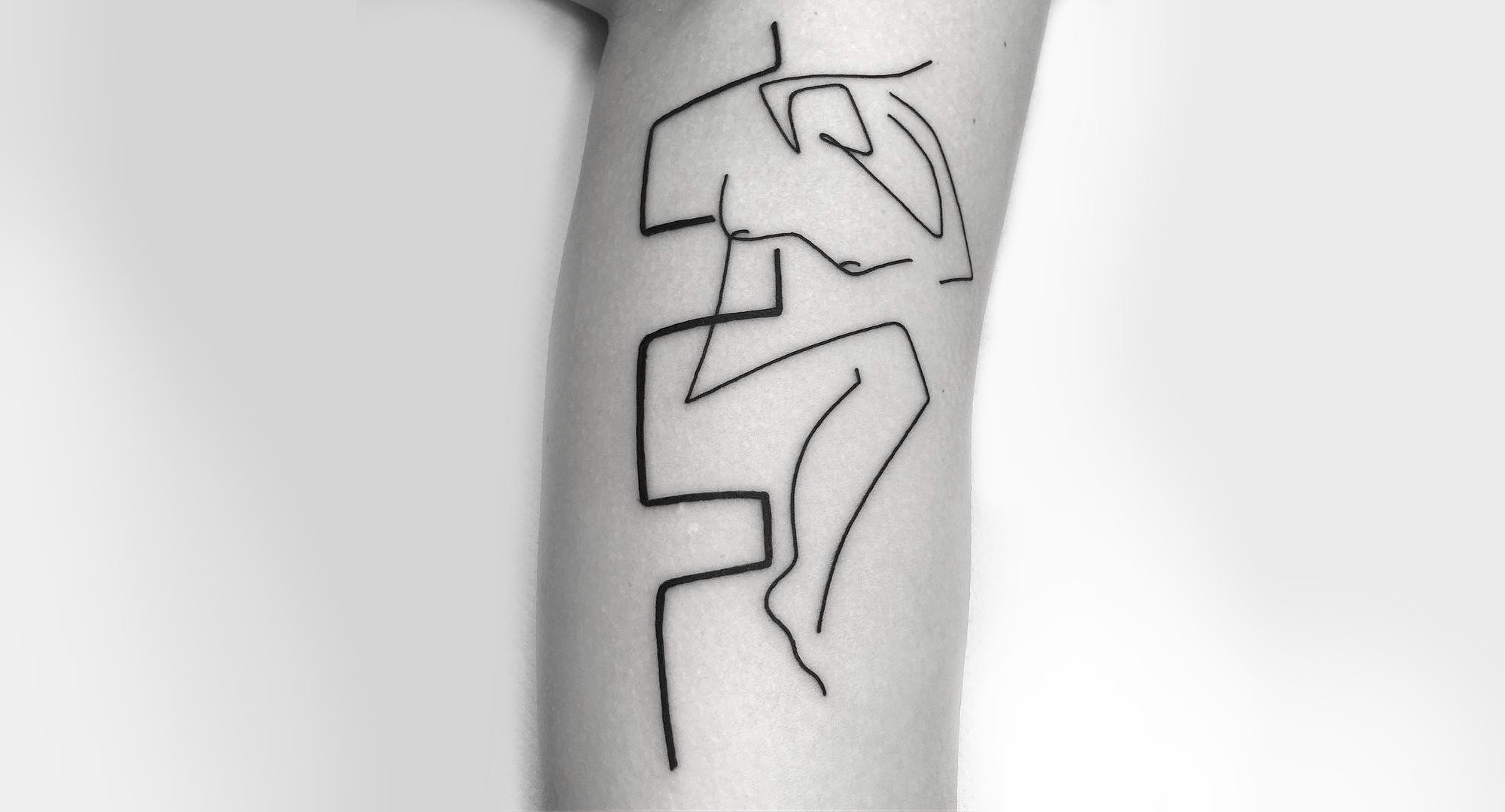 Minimalist line tattoo by Caleb Kilby