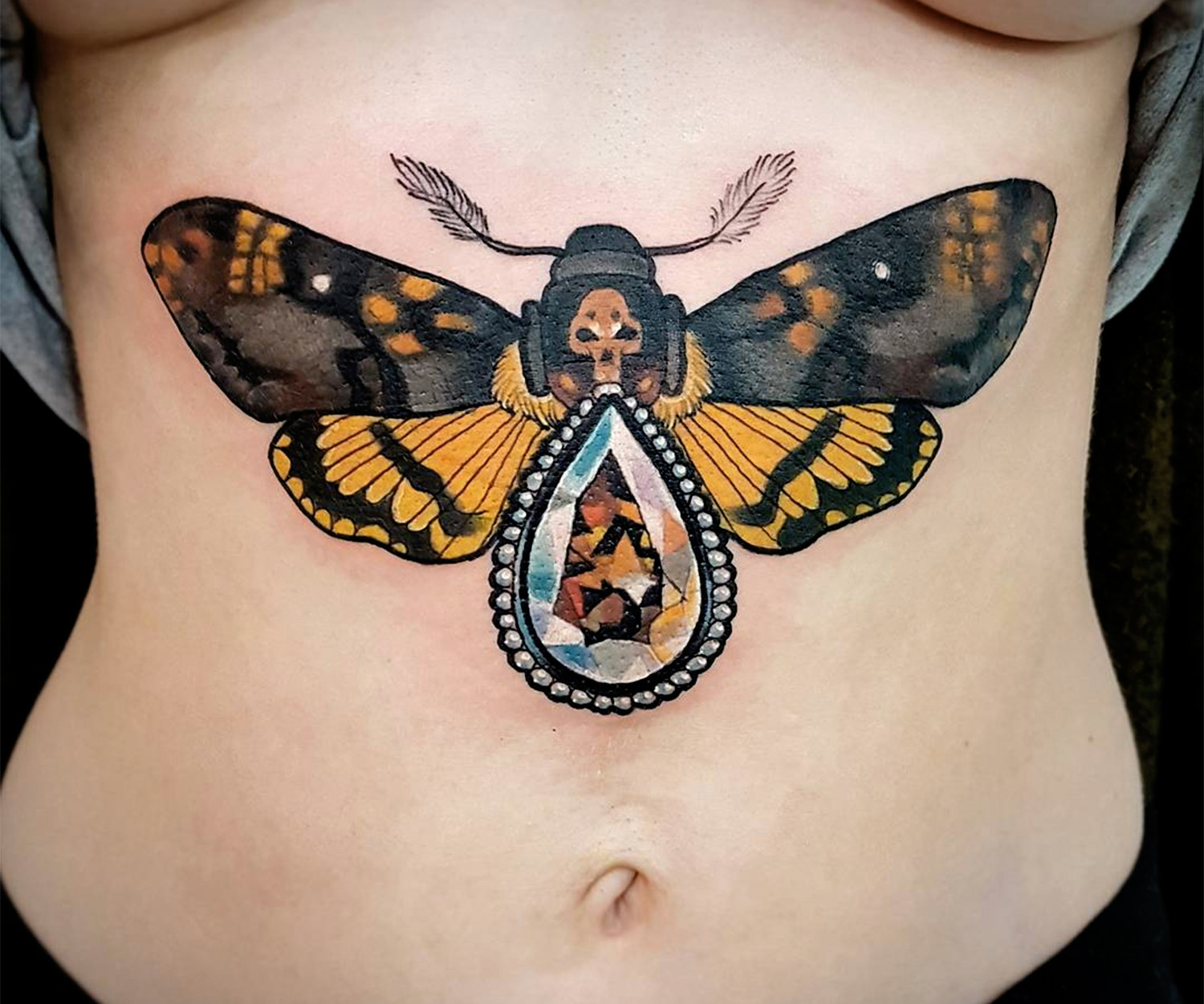 neo traditional lunar moth tattoo