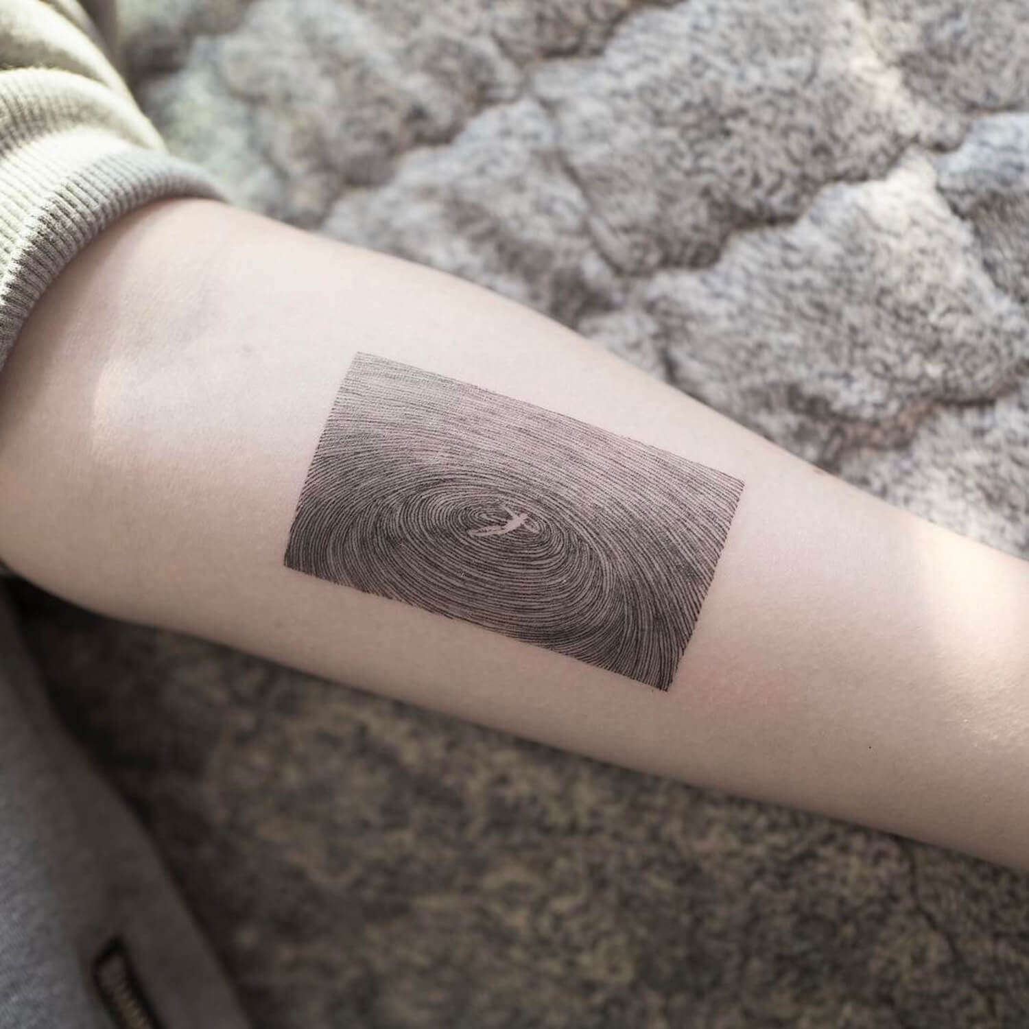 surreal fine line tatt