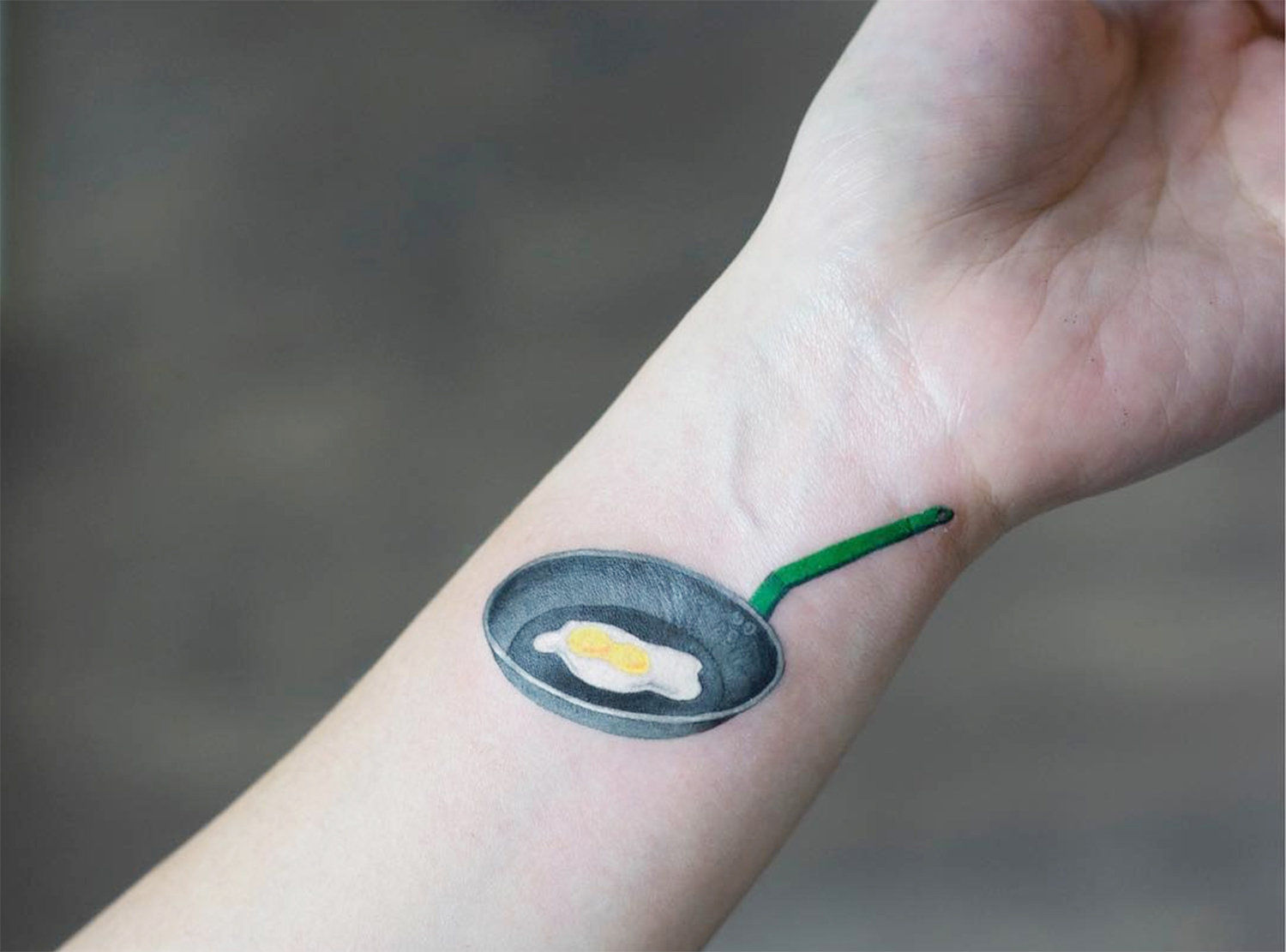 fried egg tattoo on arm by zihee