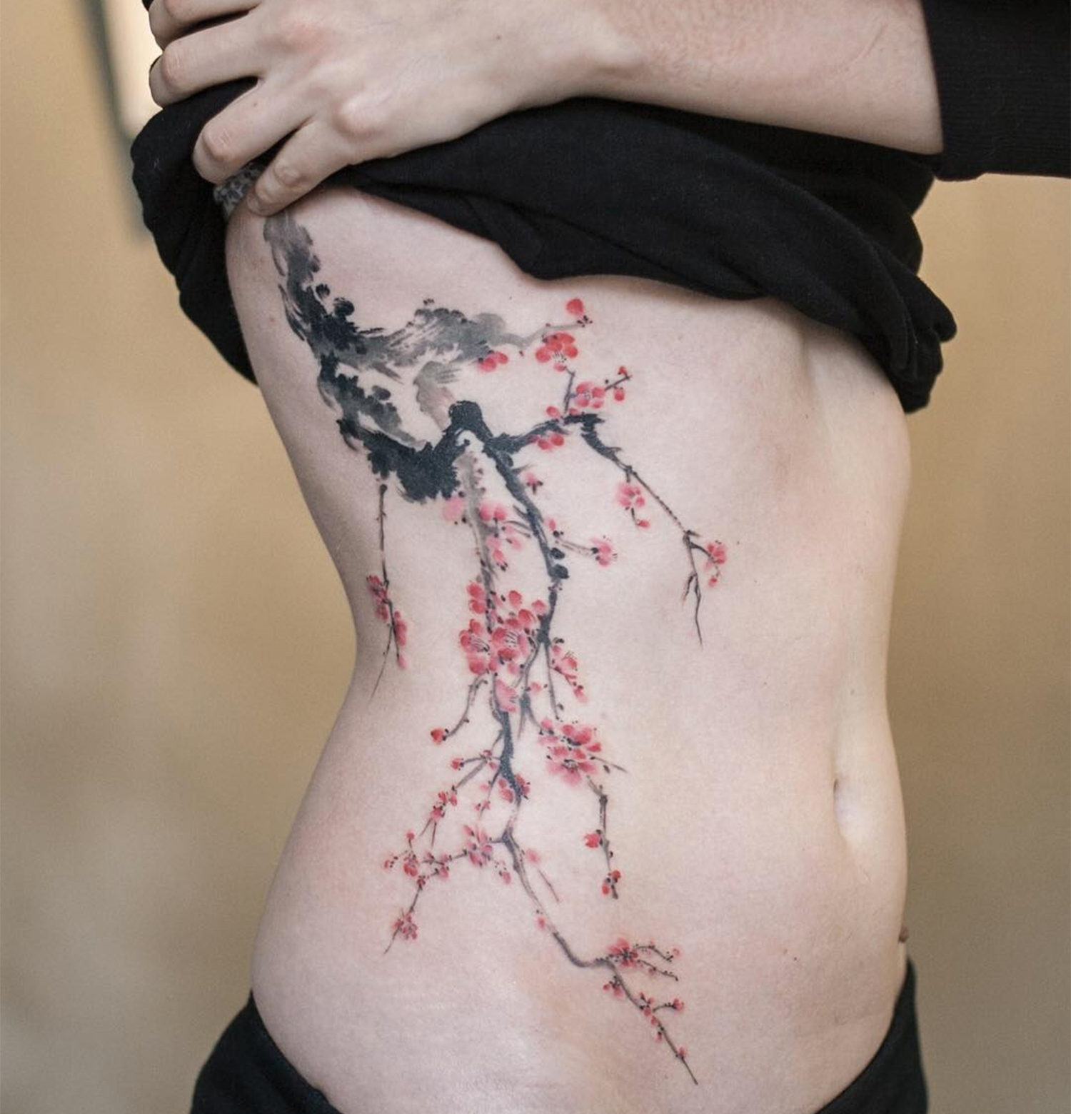 cherry blossoms, tattoo on ribs by graffittoo