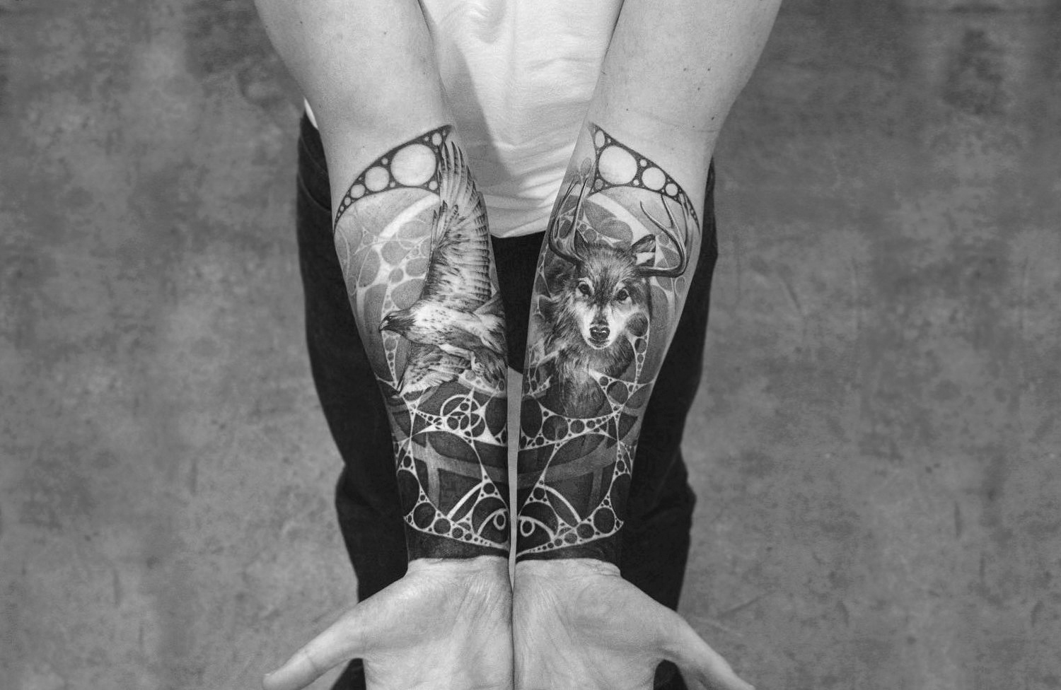 Interlocking forearm tattoos by Oscar Akermo