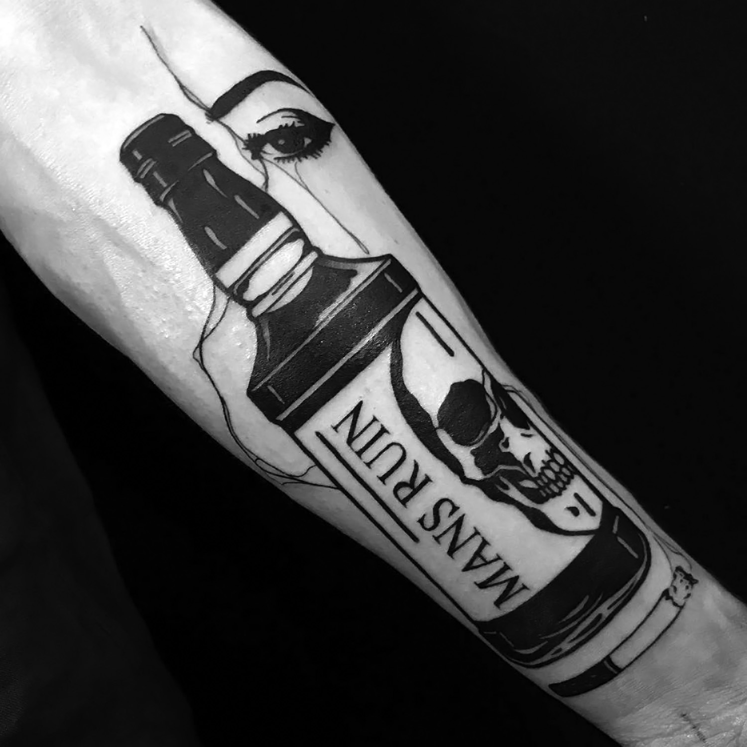 Louis Loveless tattoo smokey eyes behind bottle