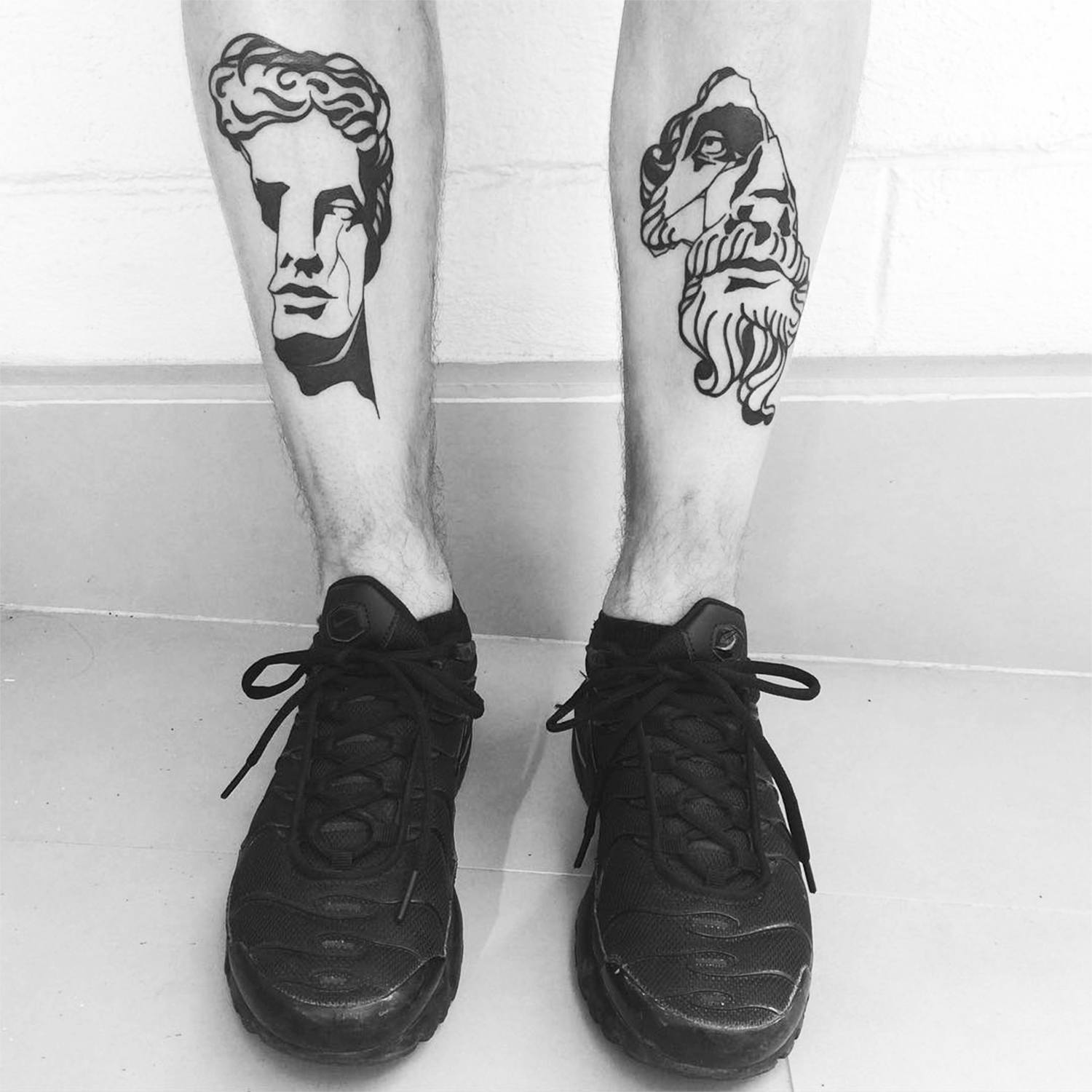 classical sculpture portrait tattoos on legs