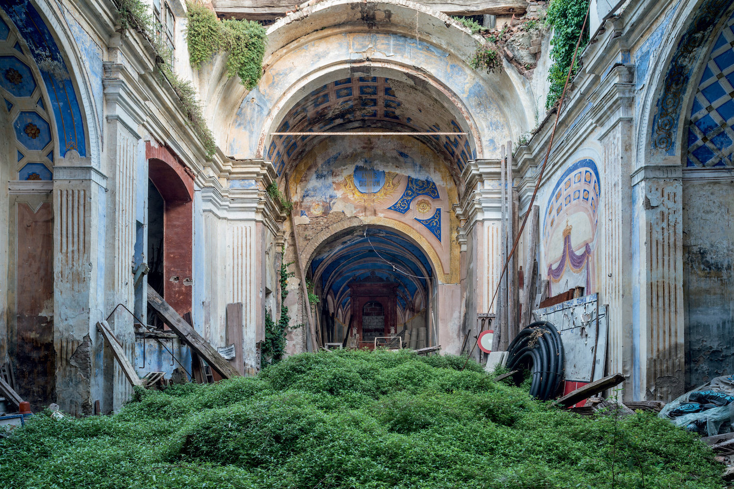 Abandoned building with nature growing in it