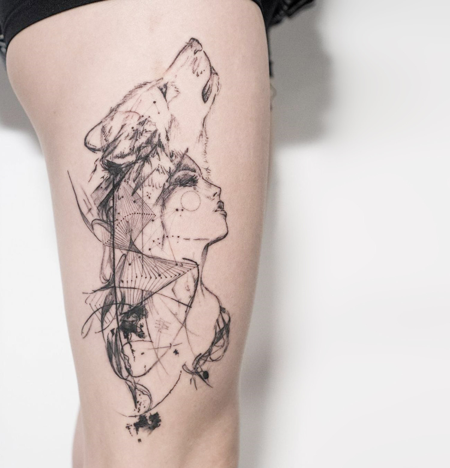 wolf girl, portrait tattoo on thigh