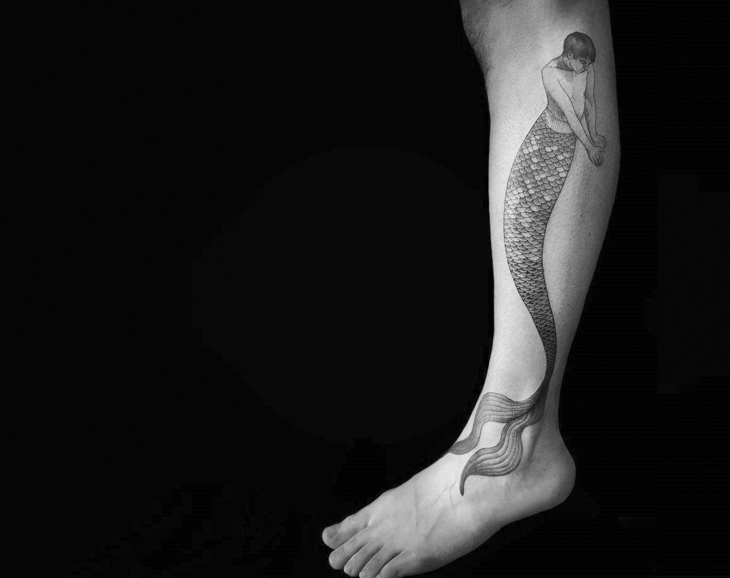 mermaid tattoo on leg