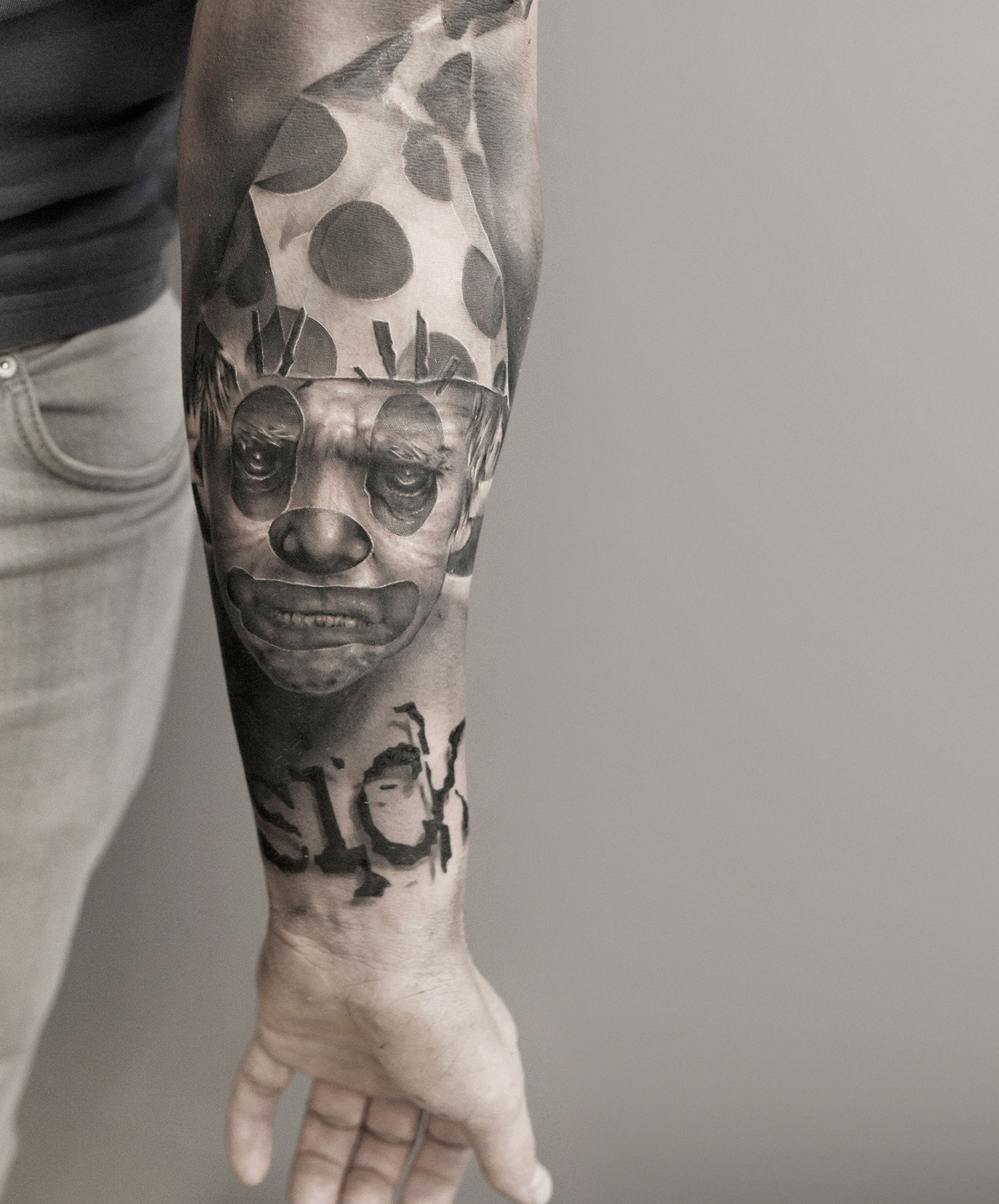 pope clown tattoo on arm