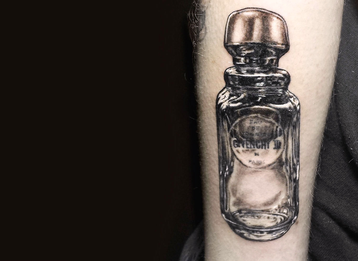 Givenchy perfume bottle tattoo by Shannon Perry