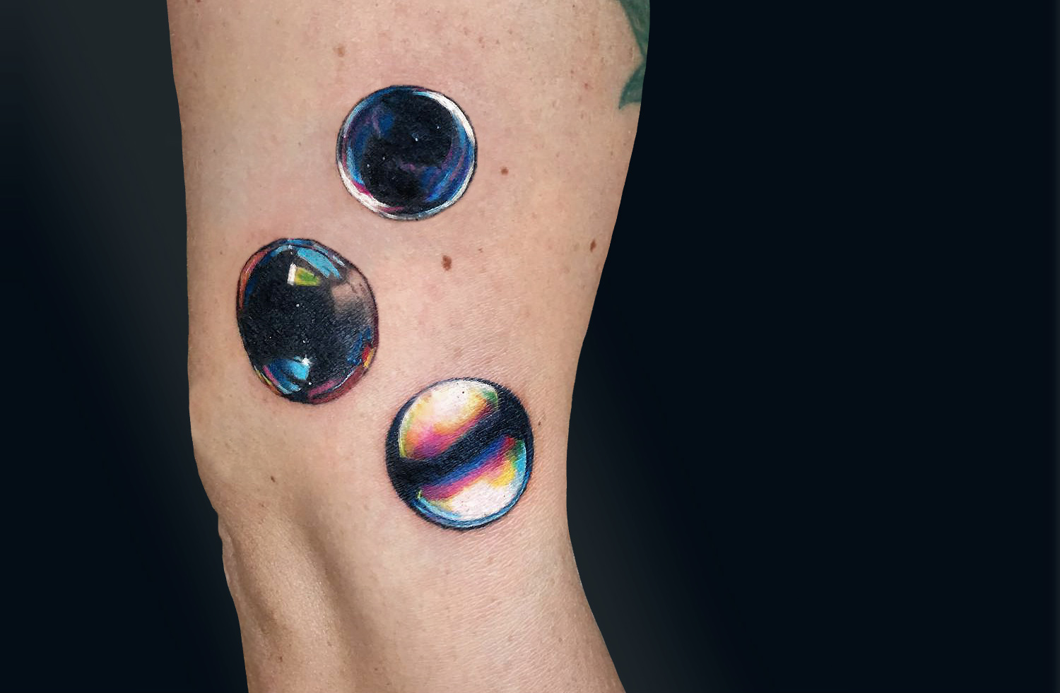 Shiny multicolored bubble tattoos by Shannon Perry
