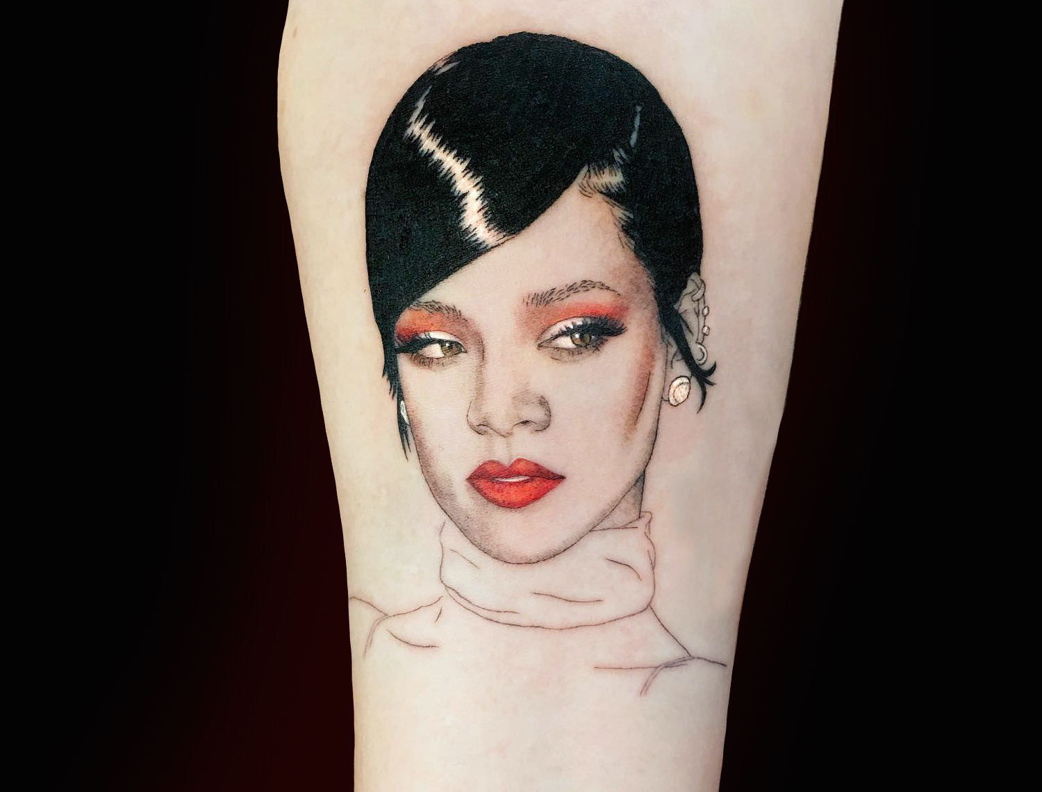 Glossy Rihanna portrait tattoo by Shannon Perry
