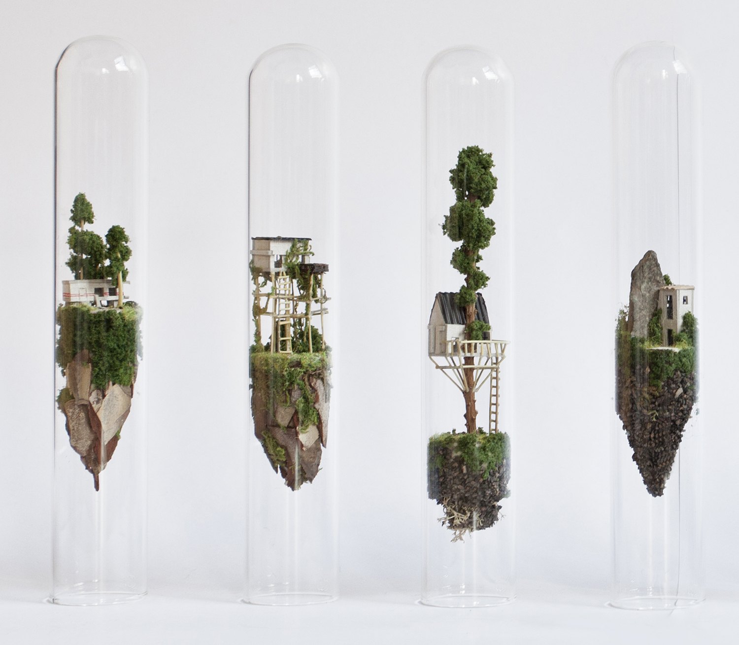 Miniature sculptures in glass tubes