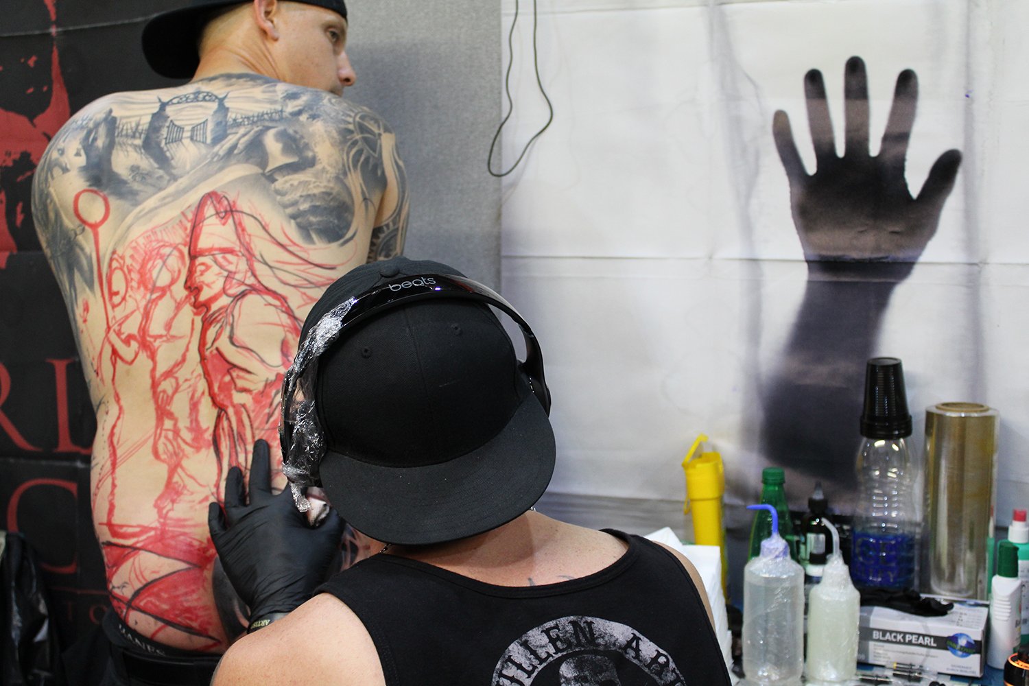 Luke Palan tattooing back