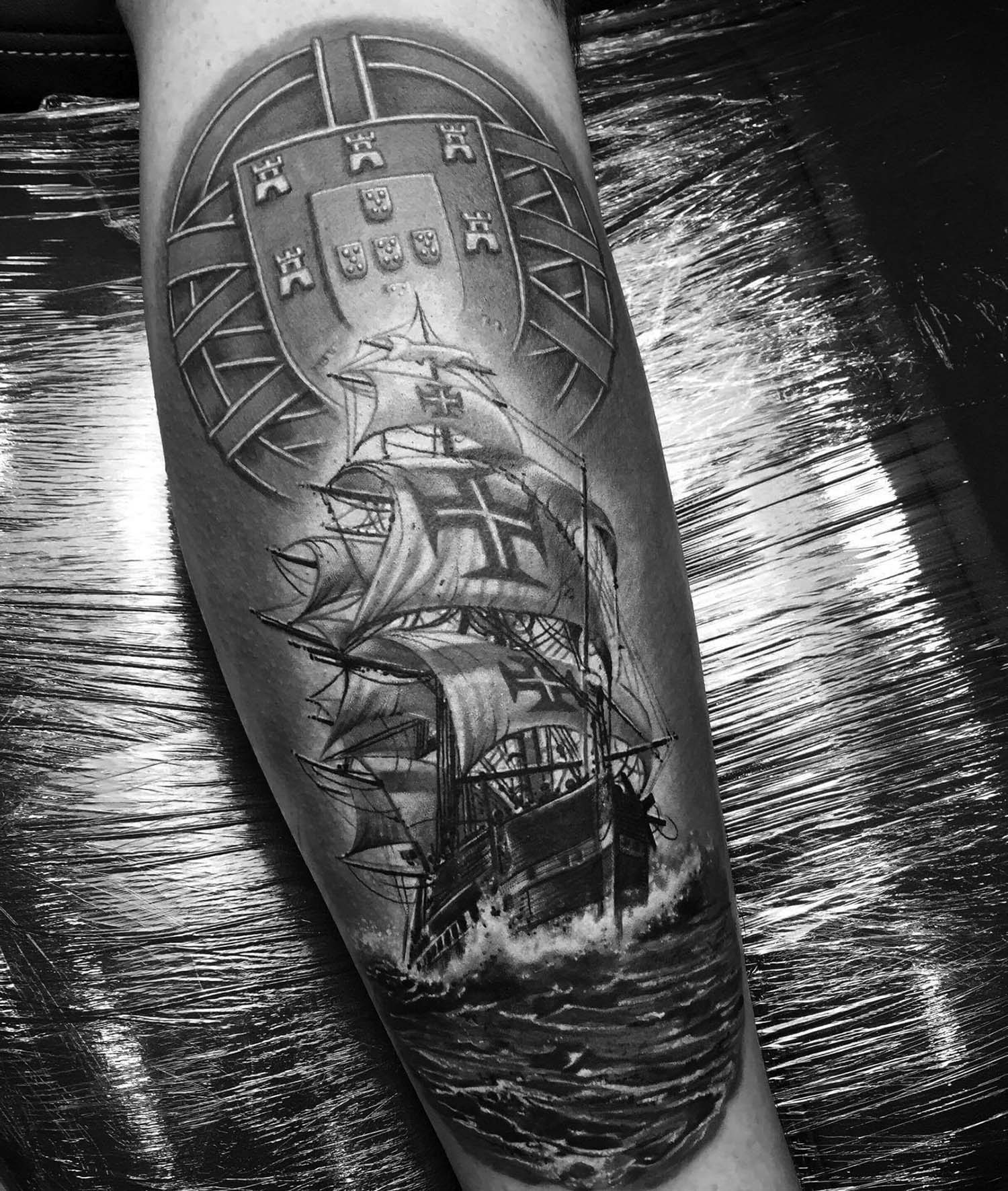 Hyperrealistic tattoo of a ship