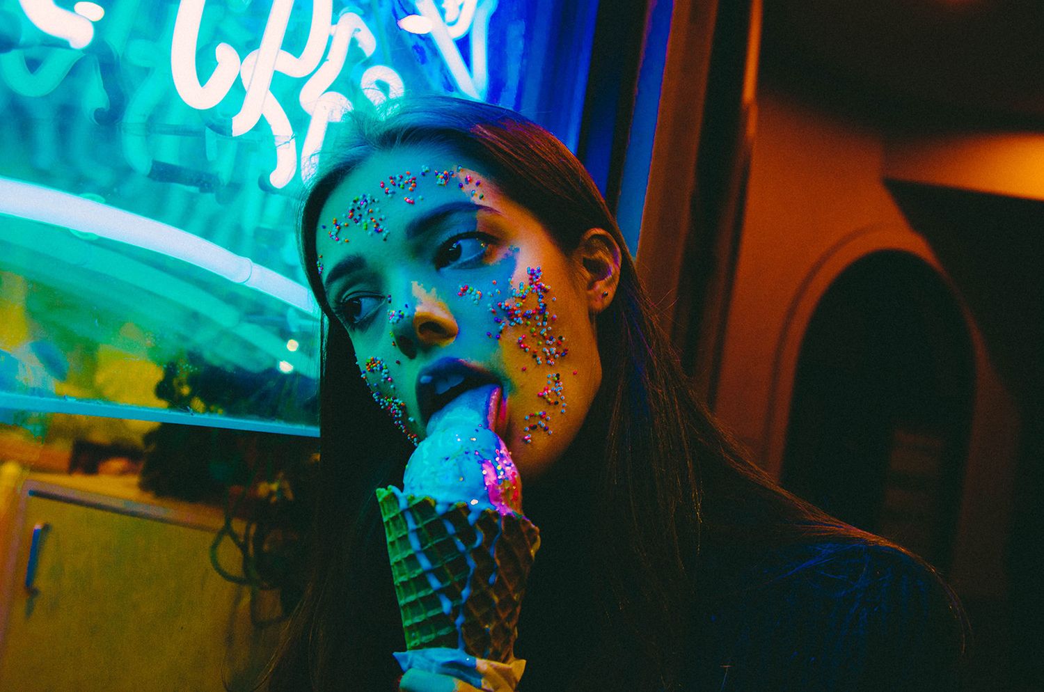 Woman licking ice cream, consumption, photography by Michael Brewington