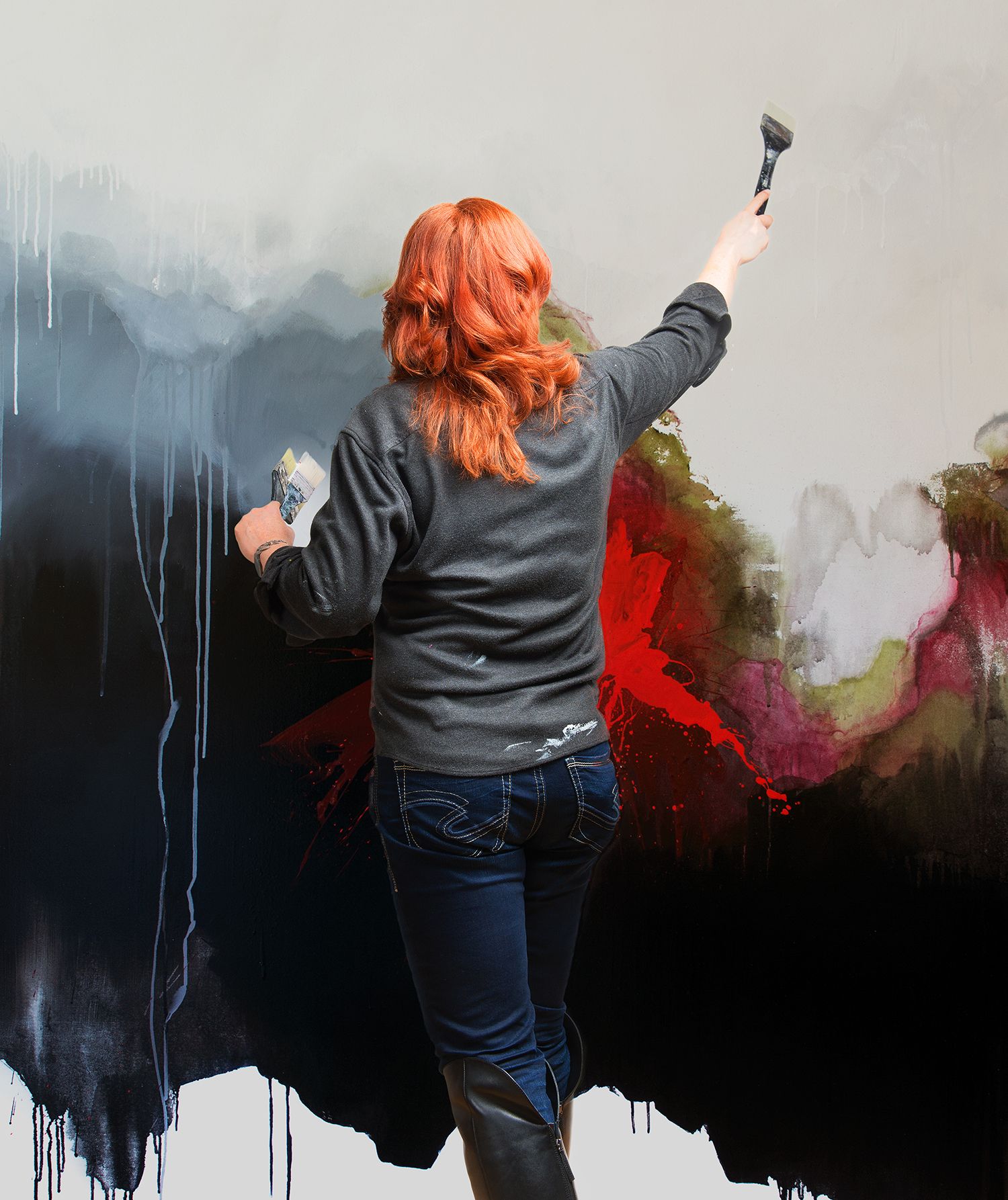 artist sylvie adams painting a large piece