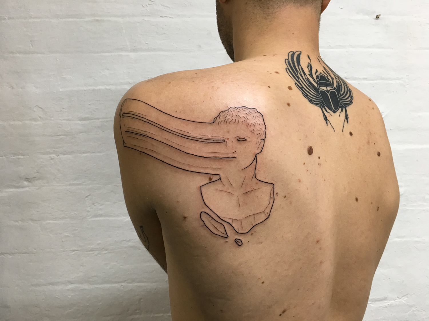 Adam Traves, Disinhibition - face melt tattoo
