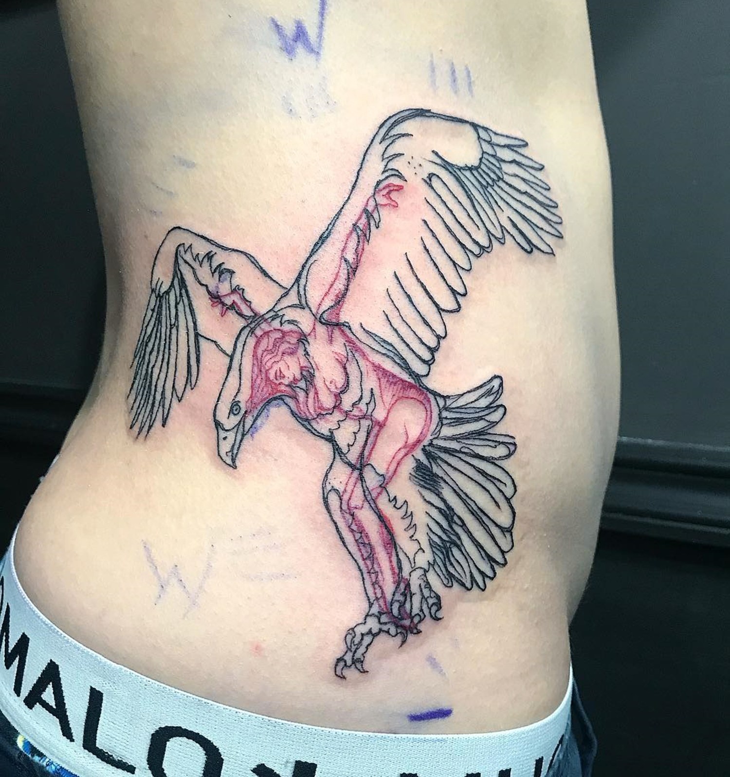 eagle and woman tattoo, red and black