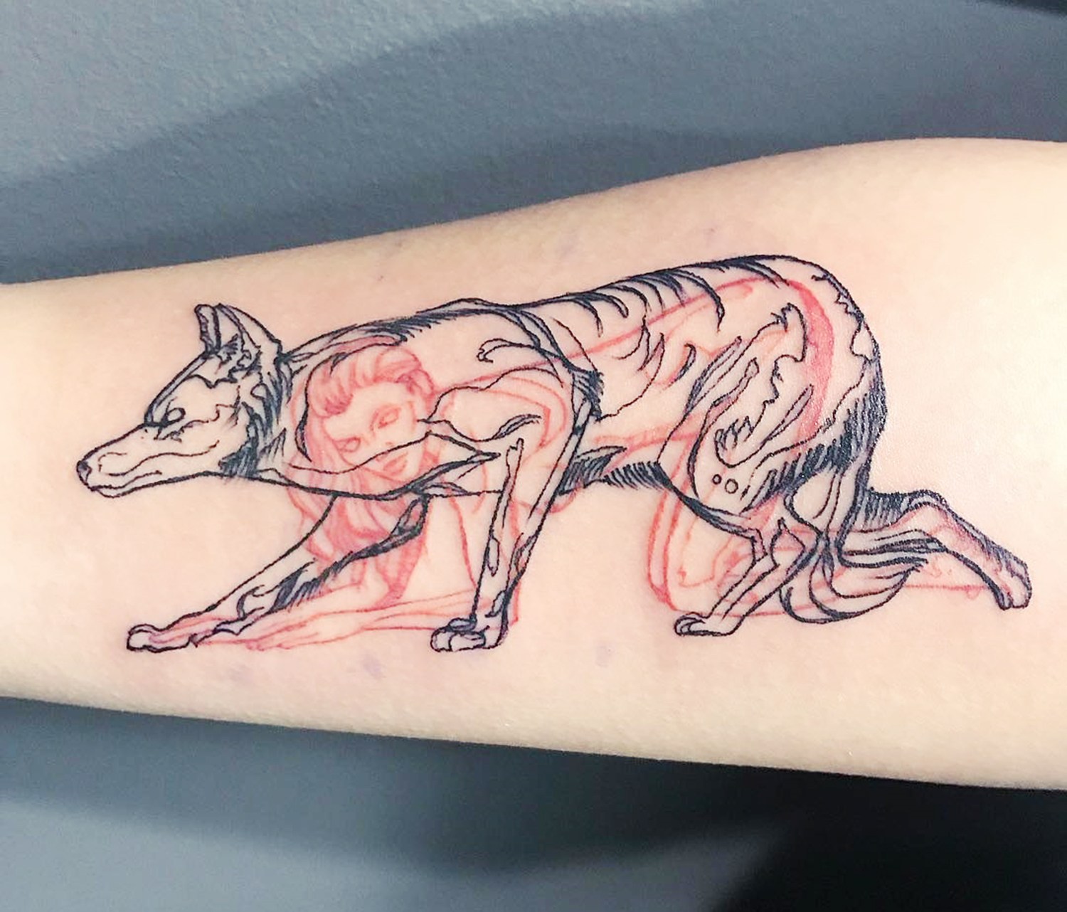 woman and beast crawling tattoo