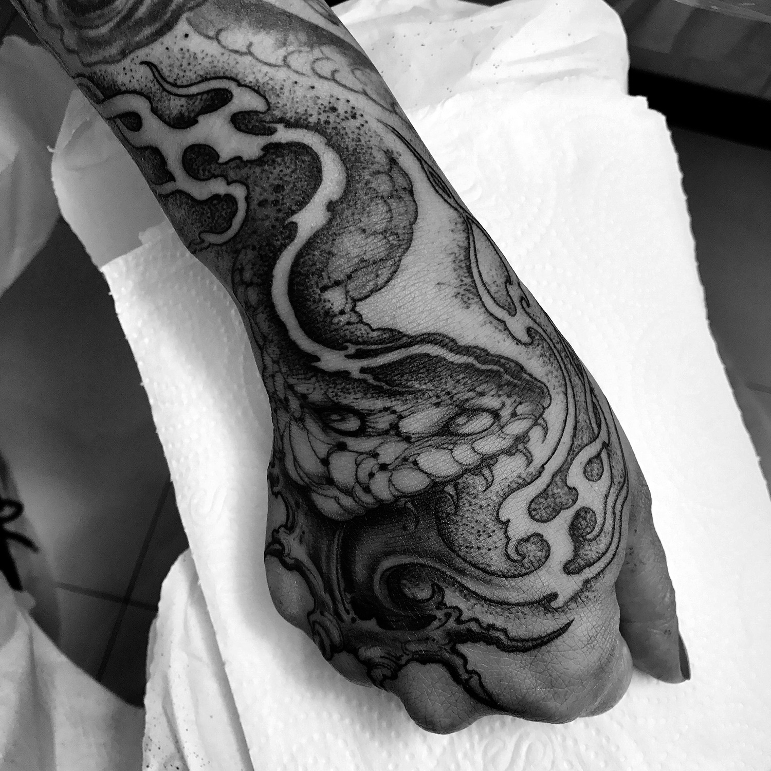 Joao Bosco - snake tattoo on hand/wrist