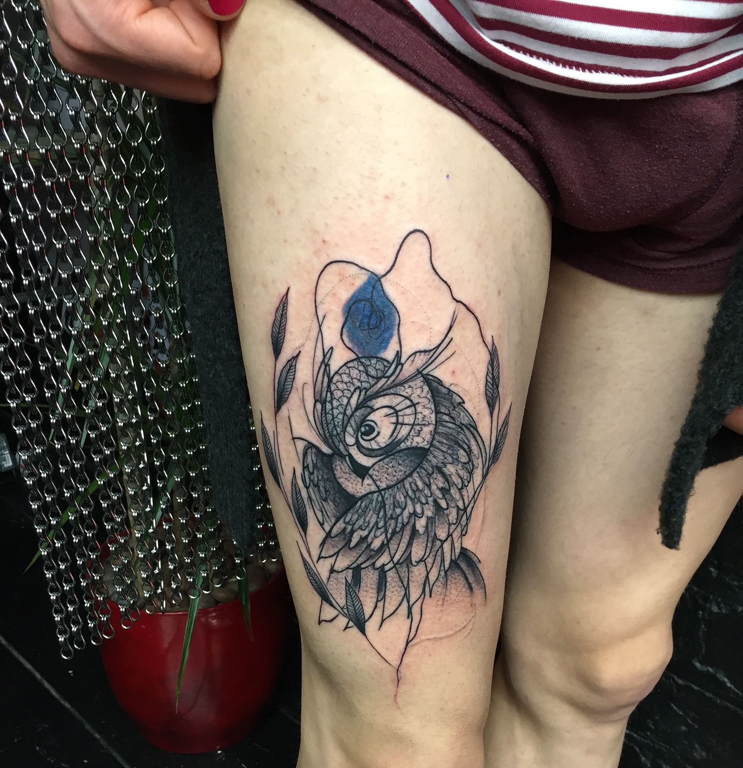 illustrative owl tattoo on thigh