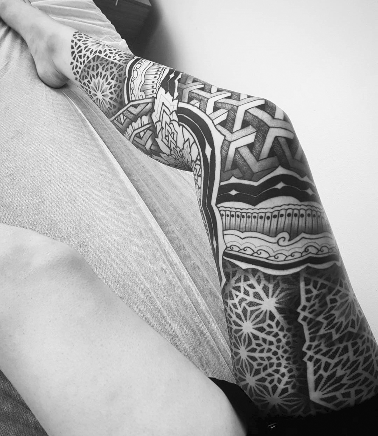 elaborate pattern tattoo on full leg