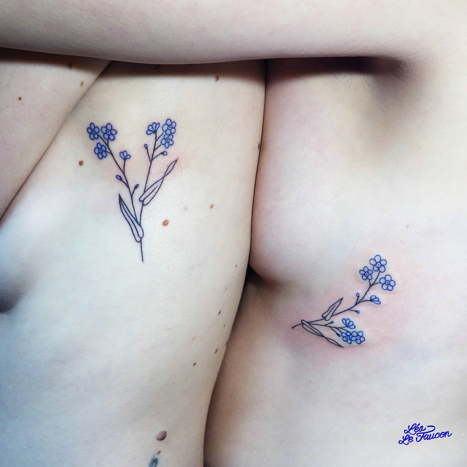 flowers on two bodies, all in one, tattoos