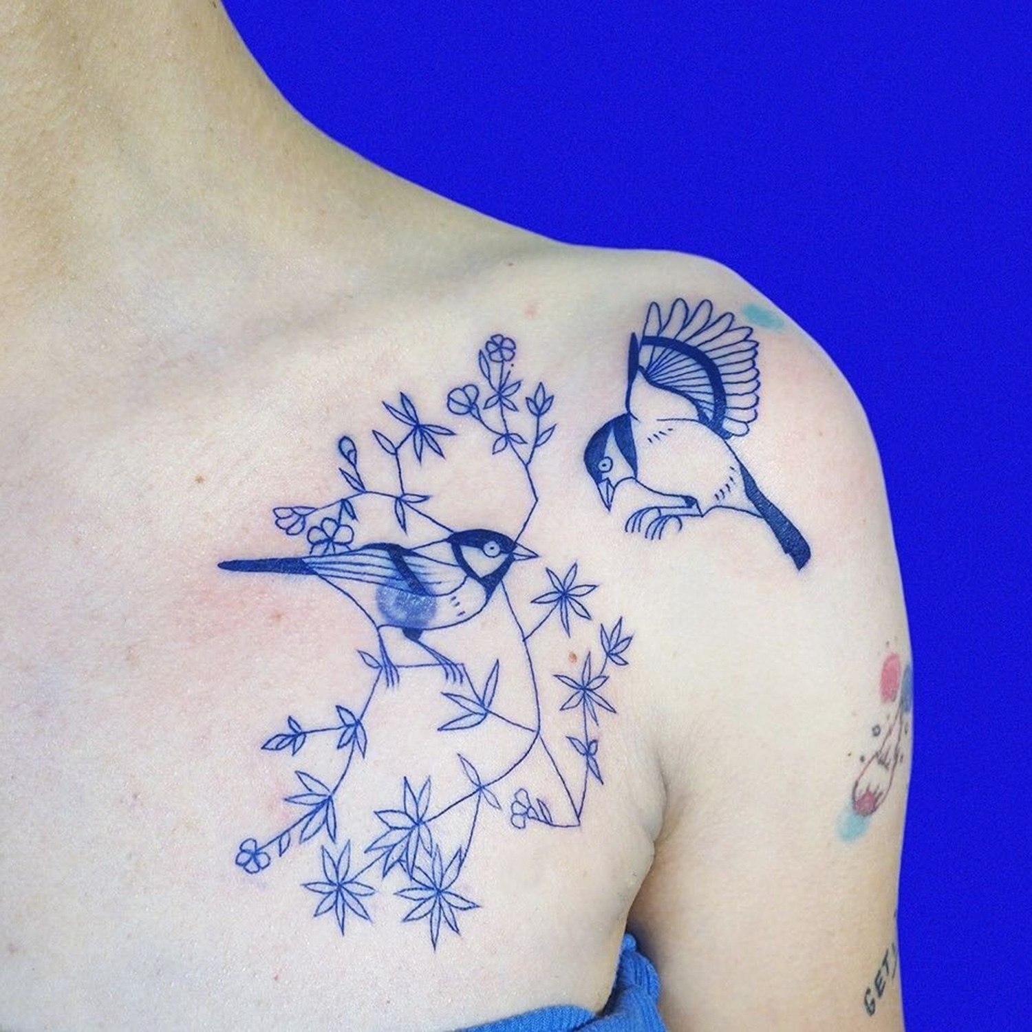 birds on shoulder, blue ink tattoo