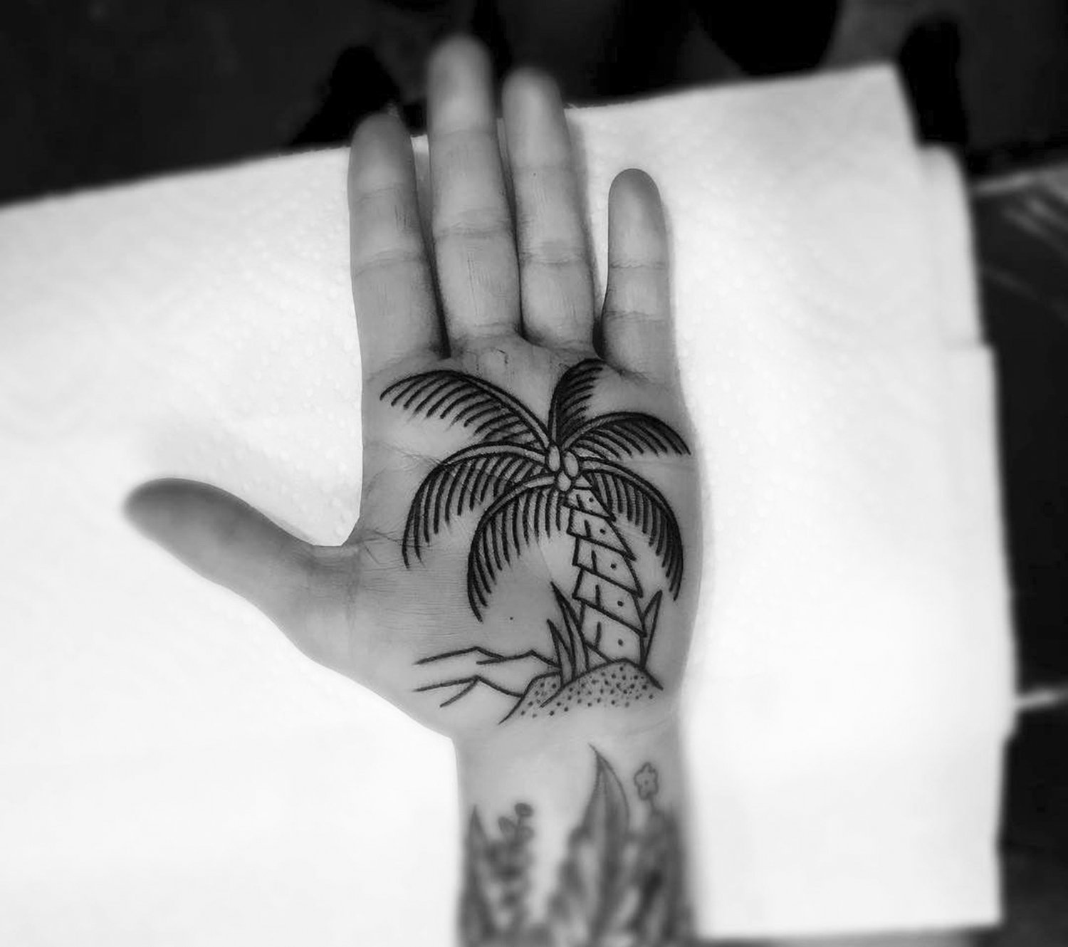 palm tree hand tattoo