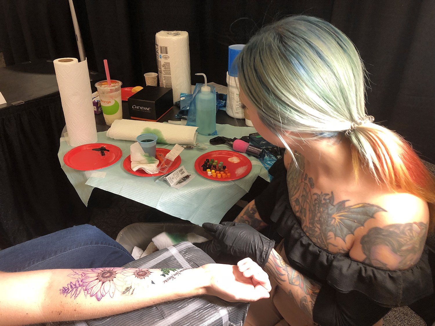 flower tattoo on arm by megan massacre, vancouver tattoo convention