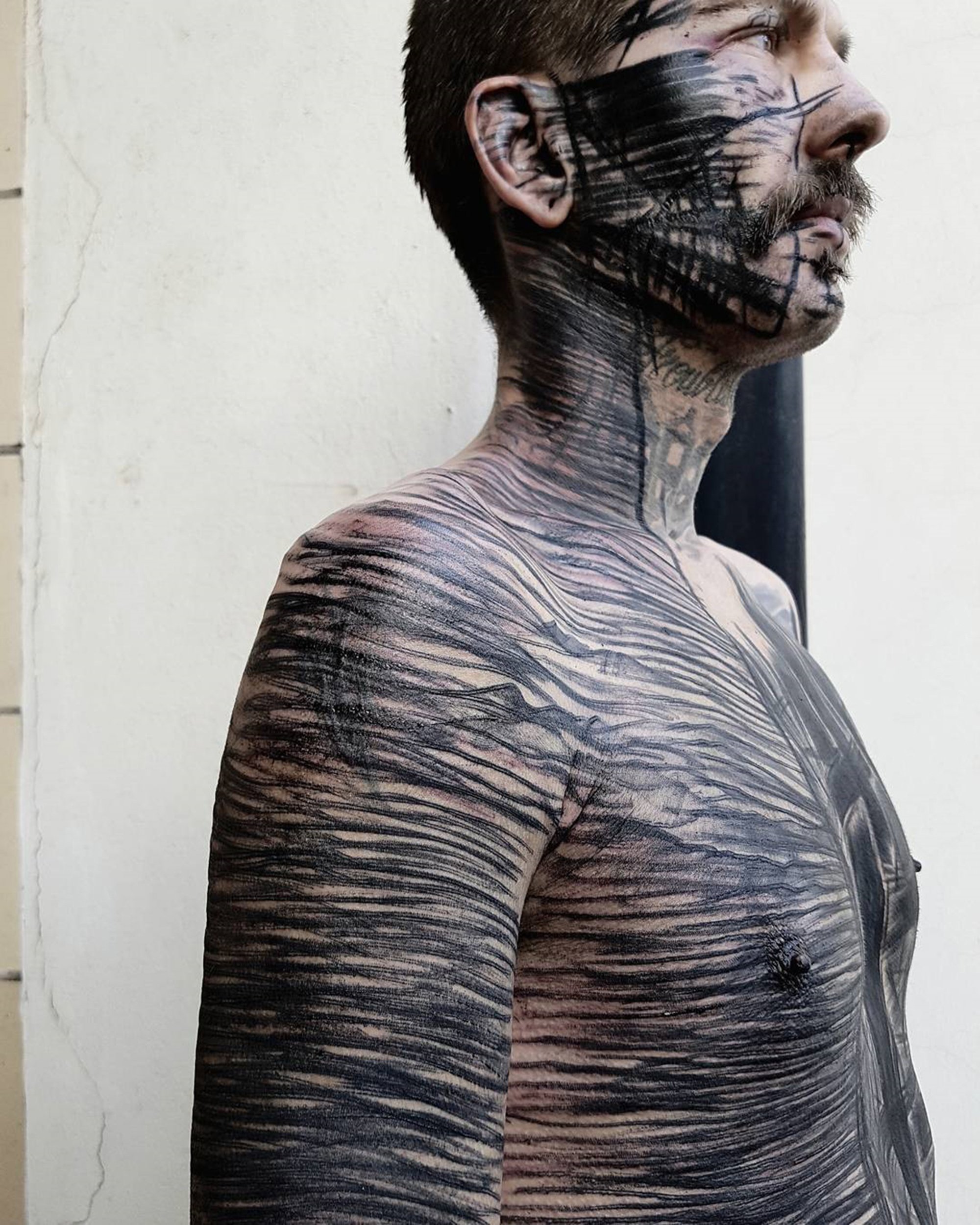 black sketchy stripes on body, brutal tattoo