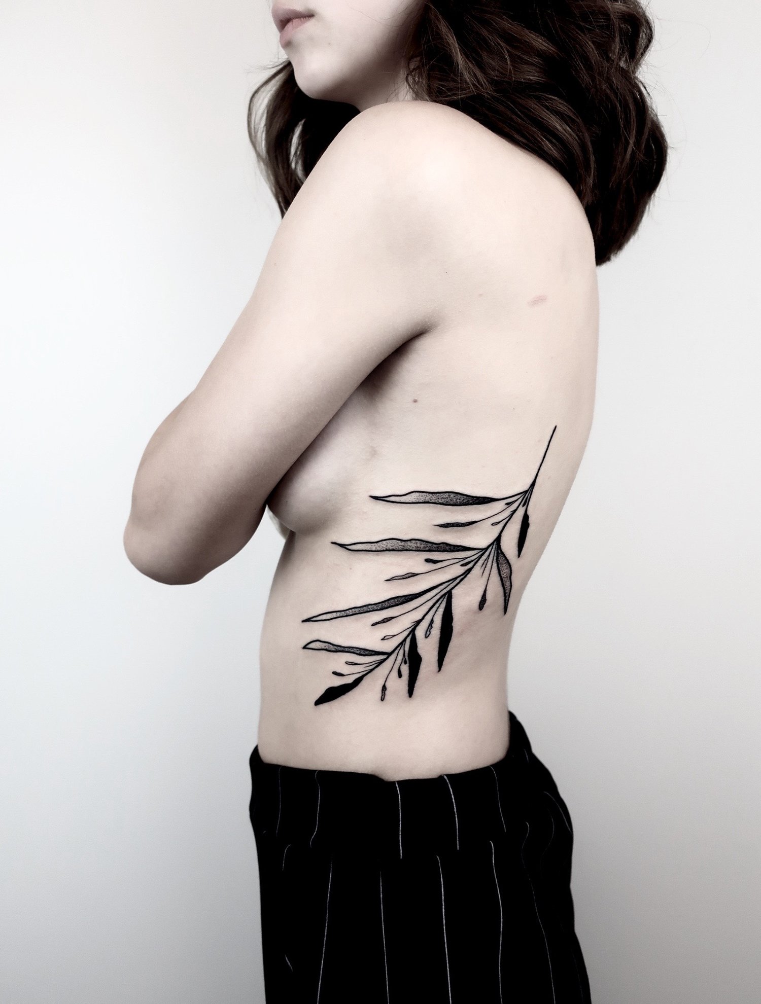 rib tattoo , plants