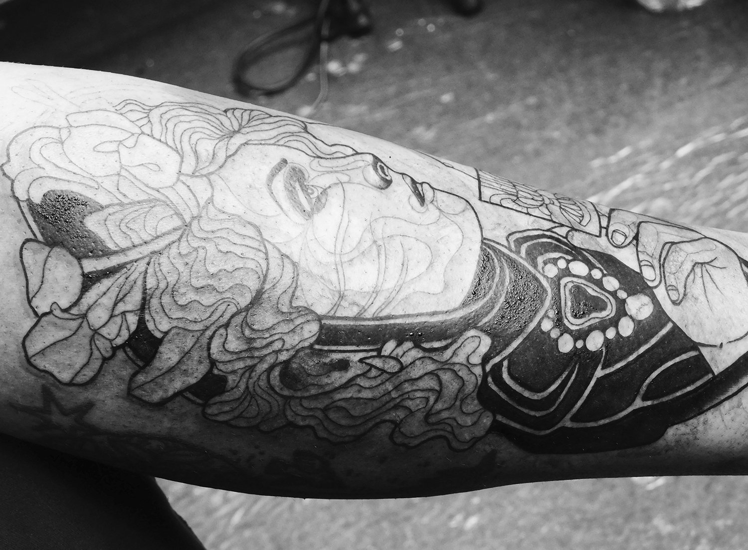 Closeup of portrait tattoo by Adrien Machete