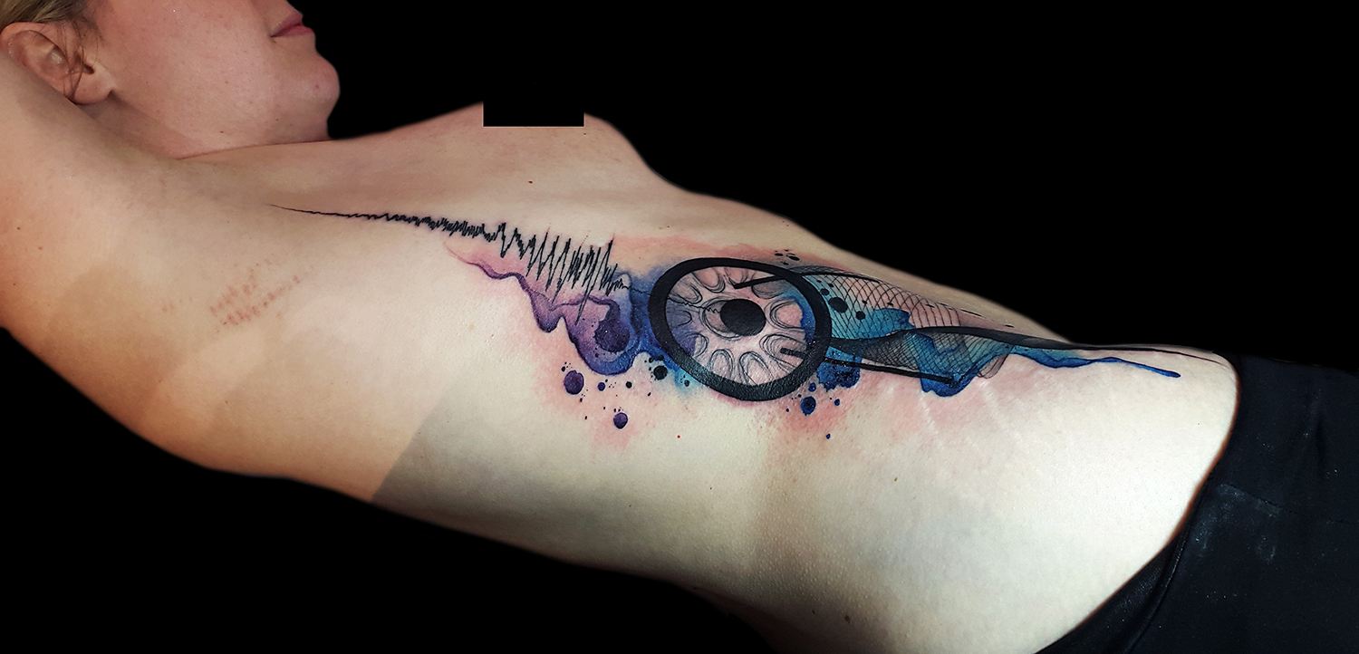abstract tattoo on ribs, purple and blue