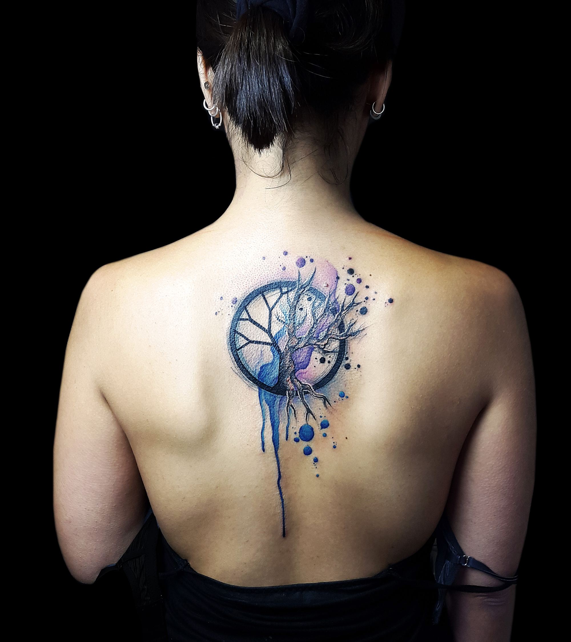 abstract watercolor tattoo on back