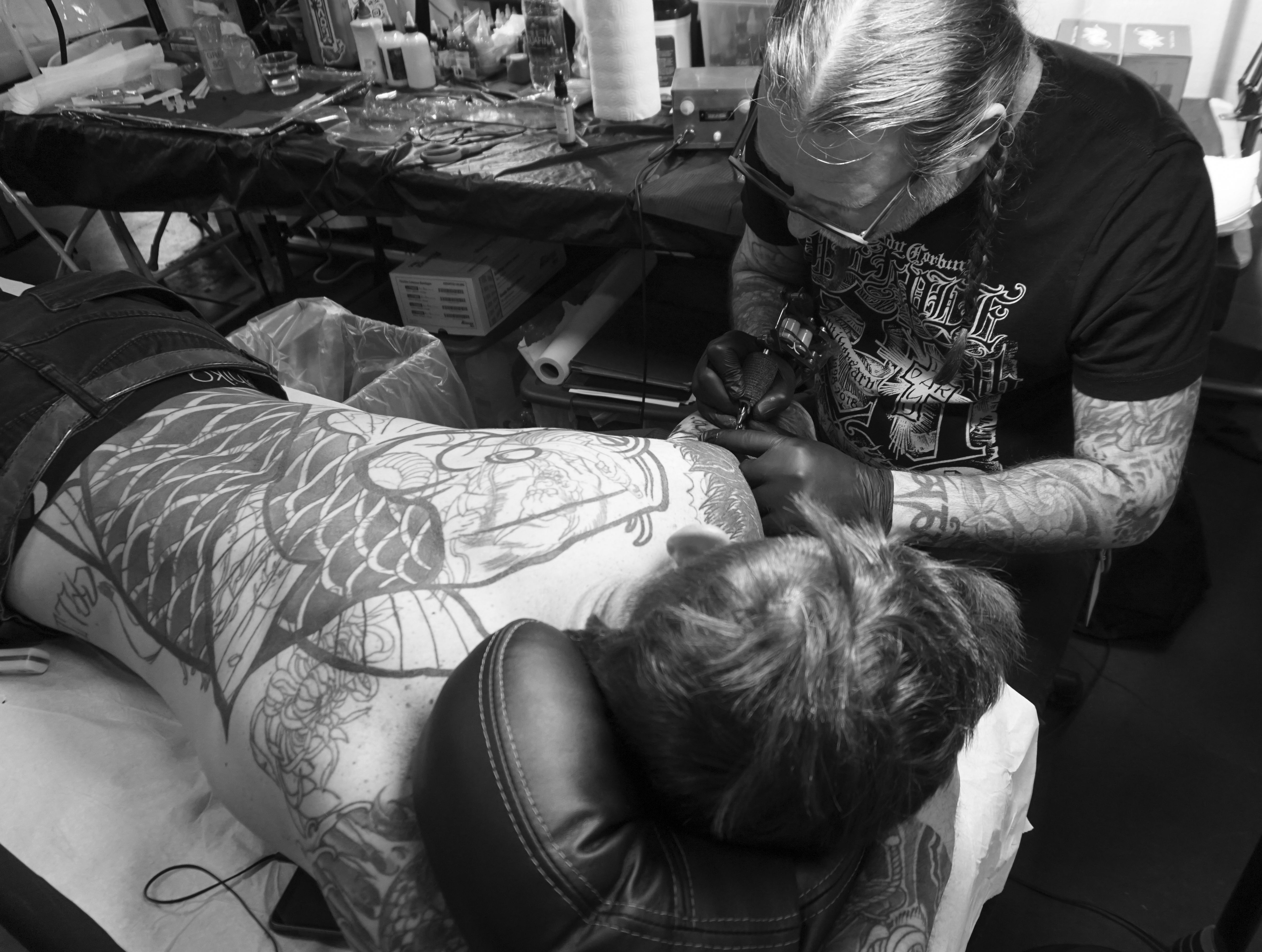 Why are tattoo conventions important for tattoo artists 