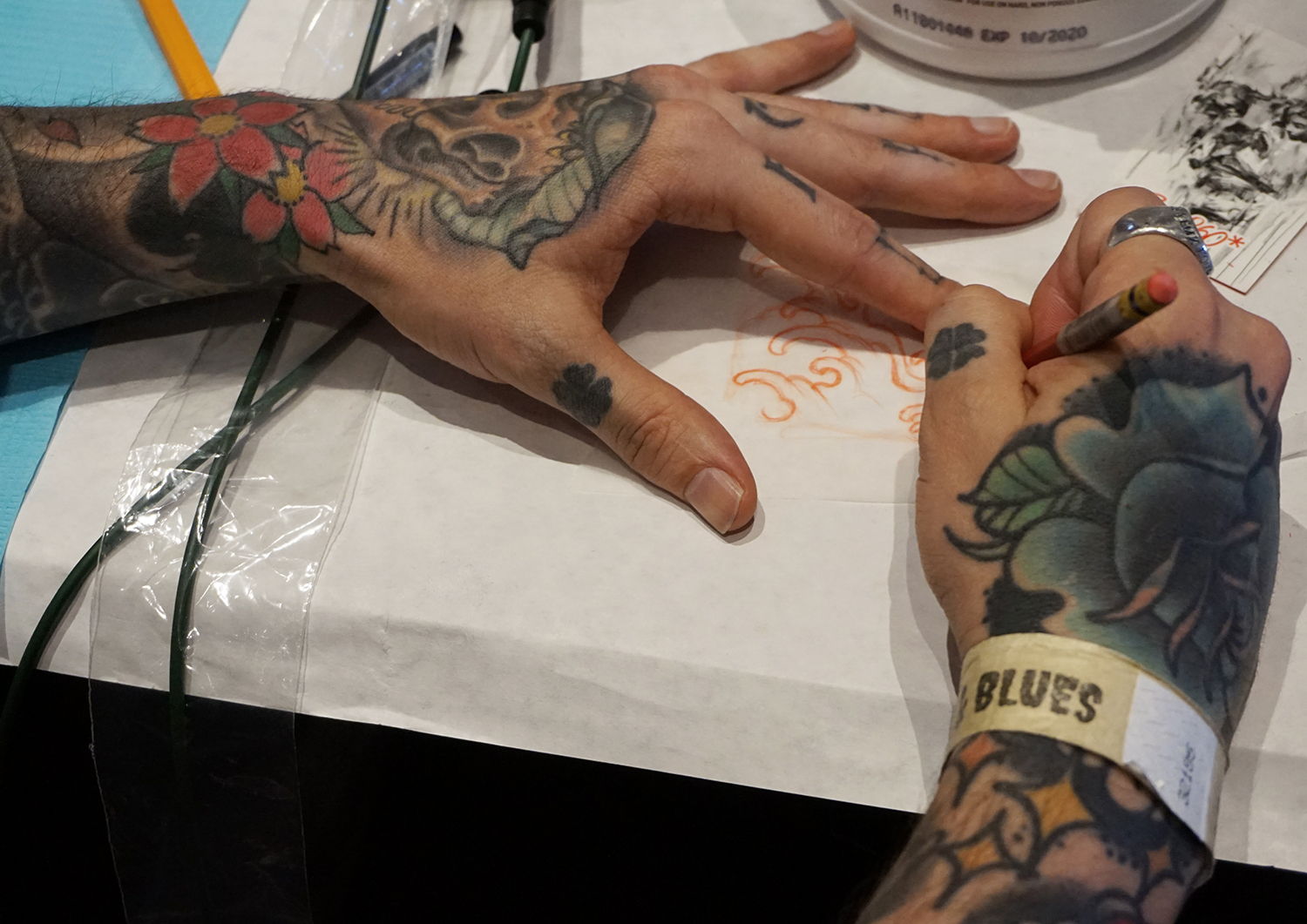 donny newman drawing an asian style tattoo on paper, santa rosa & blues event