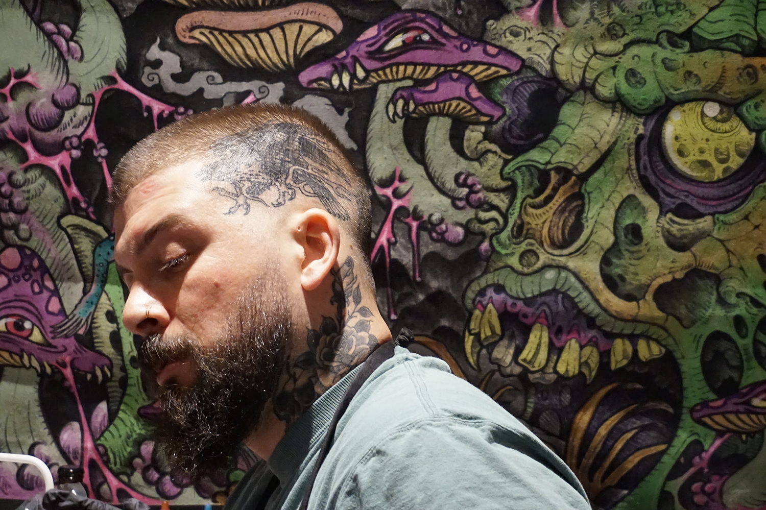 one of the tattoo artists from tiger rose tattoo studio, neck tattoo
