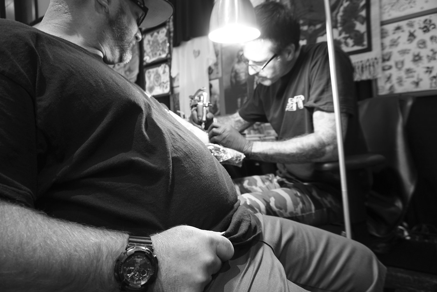 Tim Hendricks (miami ink) tattooing client at event