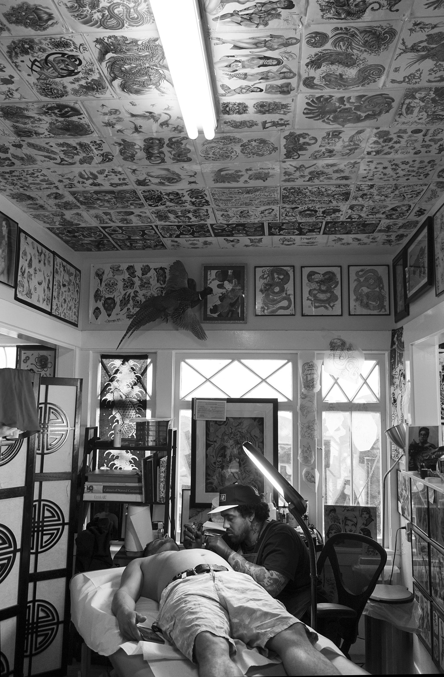 tattooist Warren (80sixer) tattooing at santarosatattoo