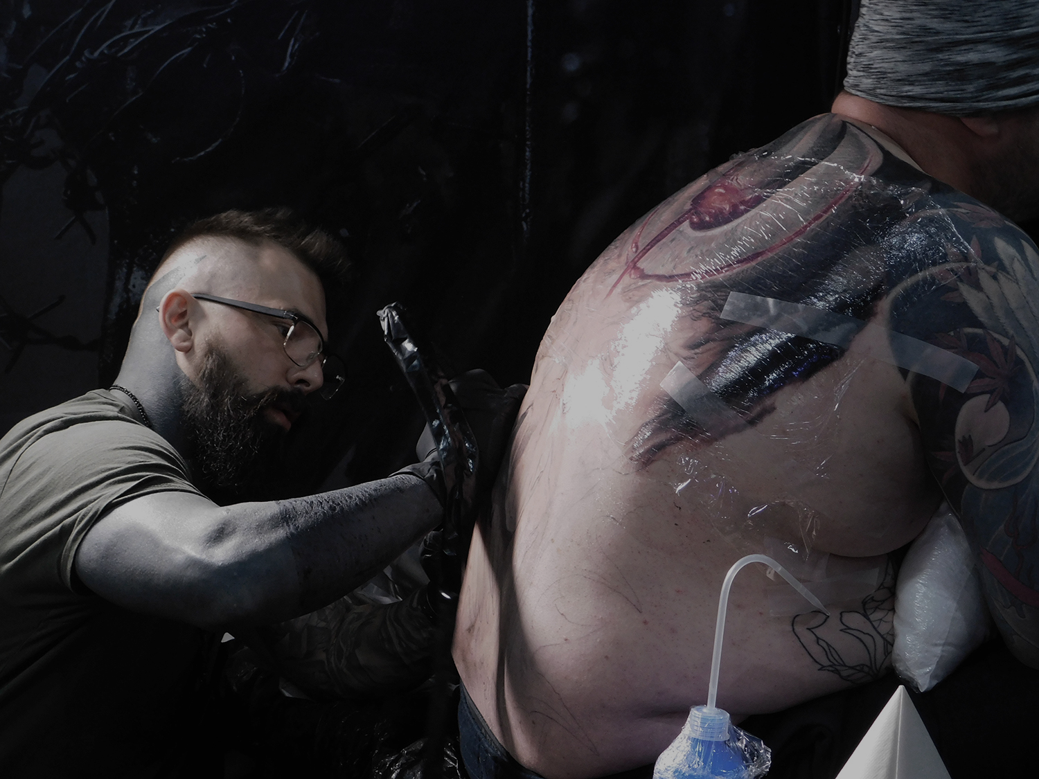 plastic wrap on tattoo, kamil mocet, london tattoo convention, tobacco dock