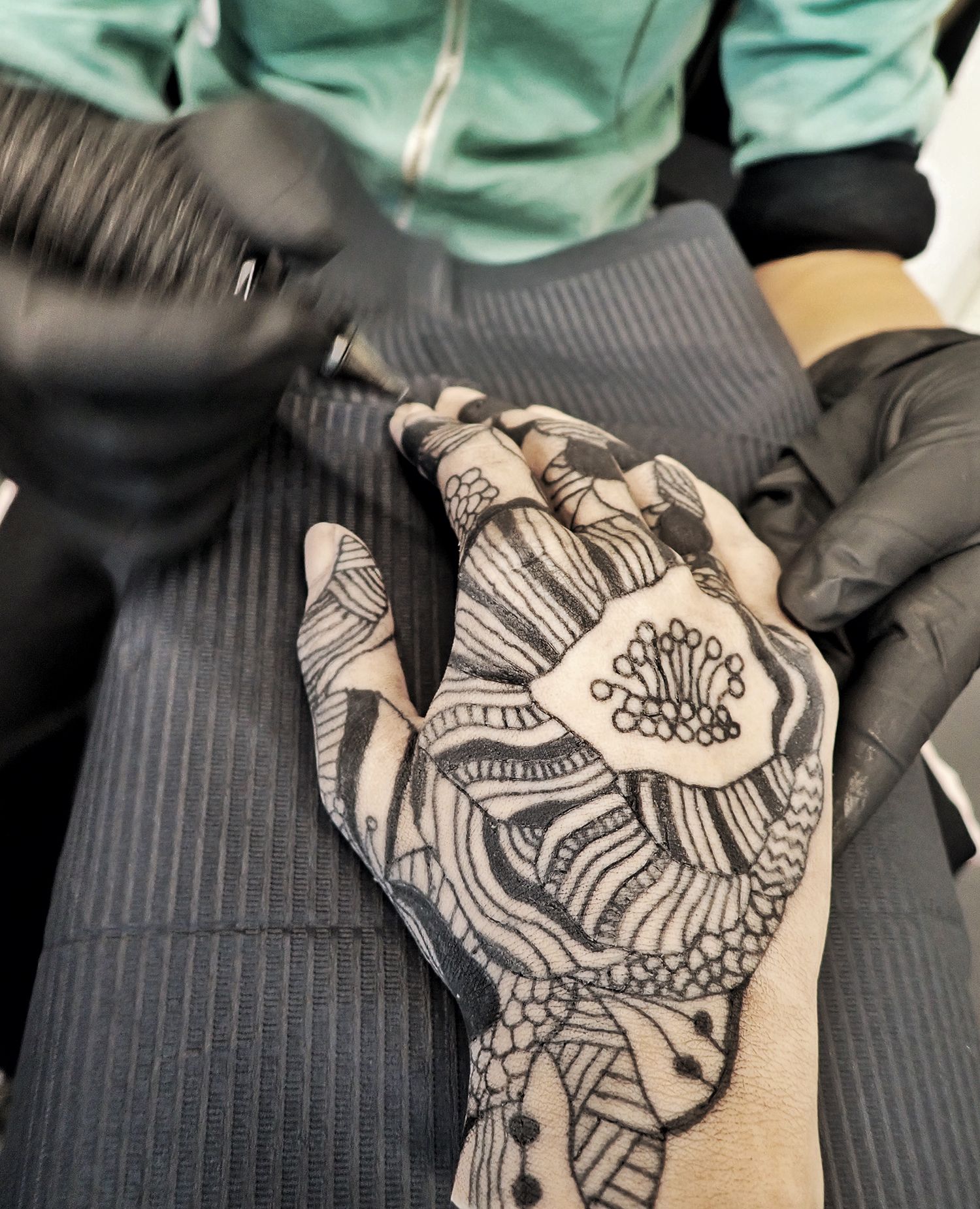 tattooing on silicone hand, blackwork