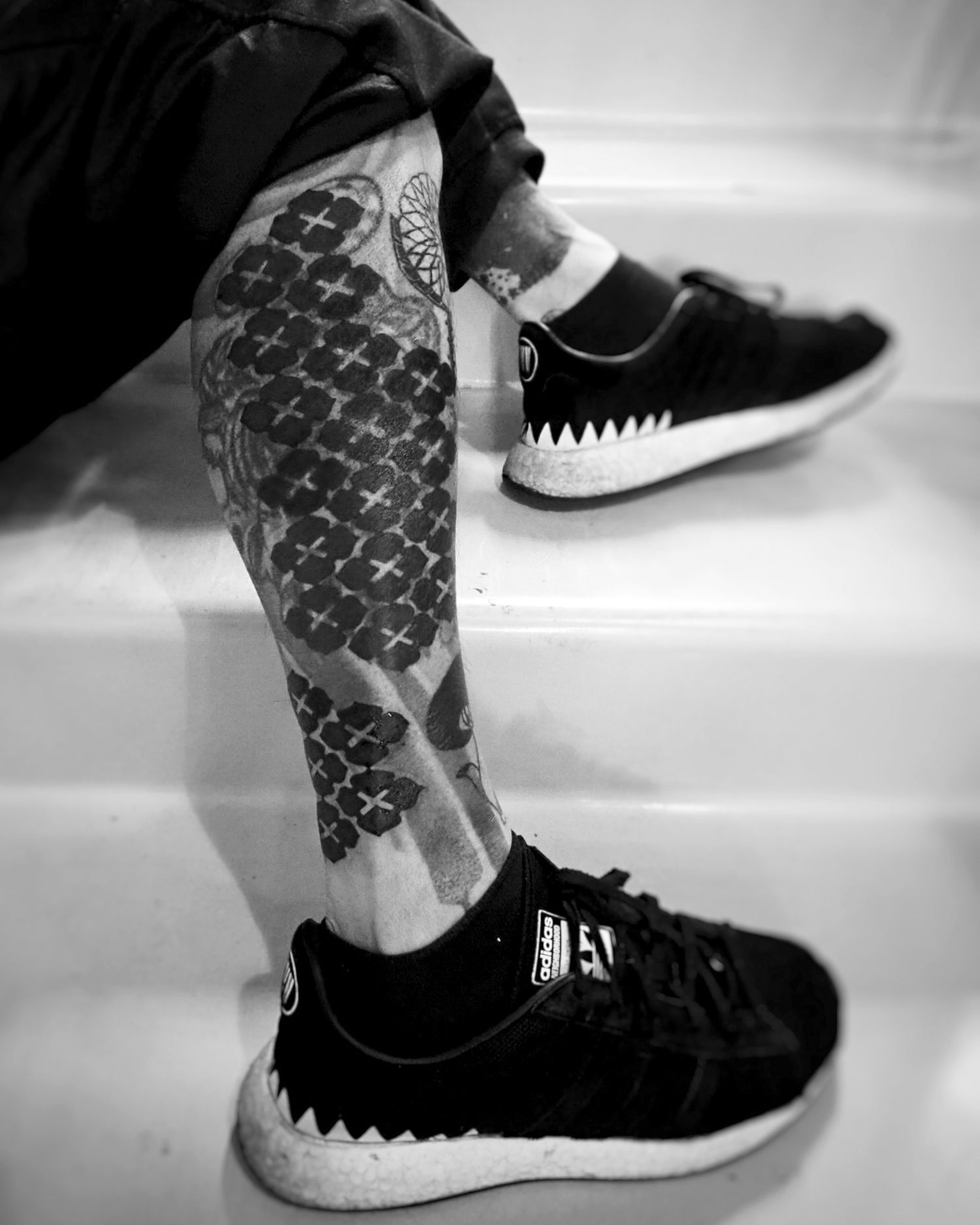Blastover tattoo (black ink) on Gakkin's leg, by his daughter