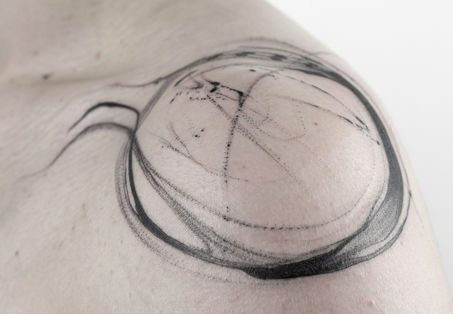 circle tattoo on shoulder, abstract