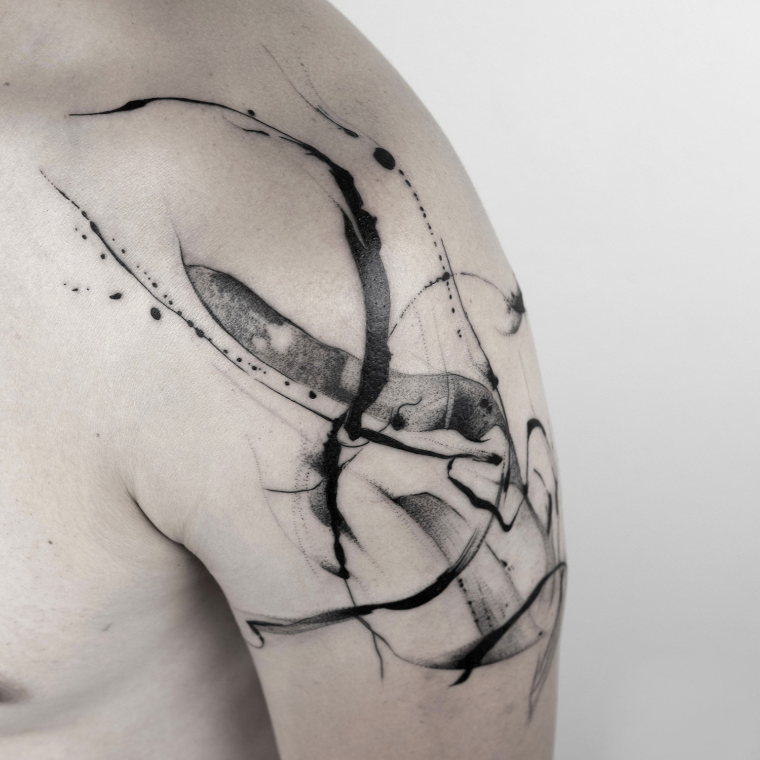 shoulder tattoo, blackwork, freehand, flow and motion, poetic