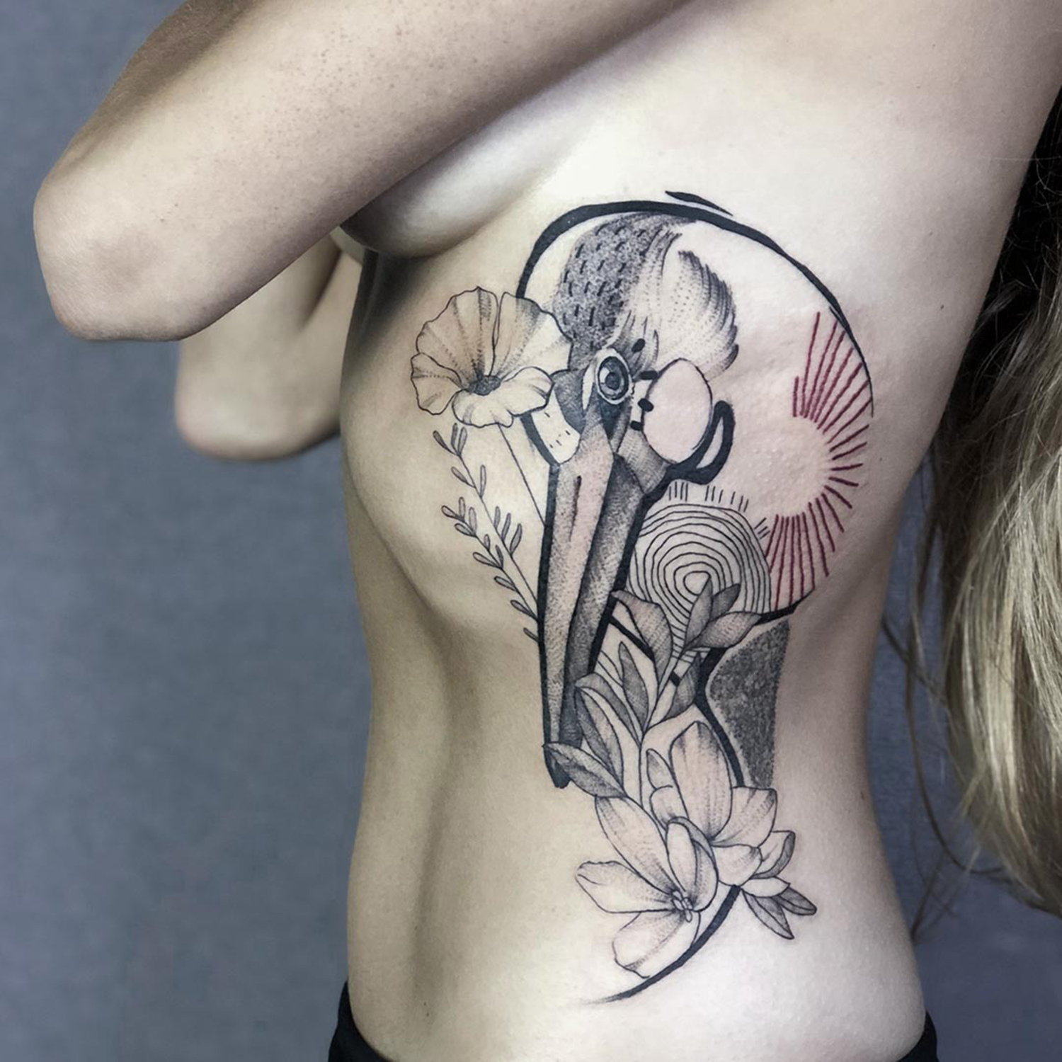 bird and flower tattoo on ribs, by shiran tattoo artist