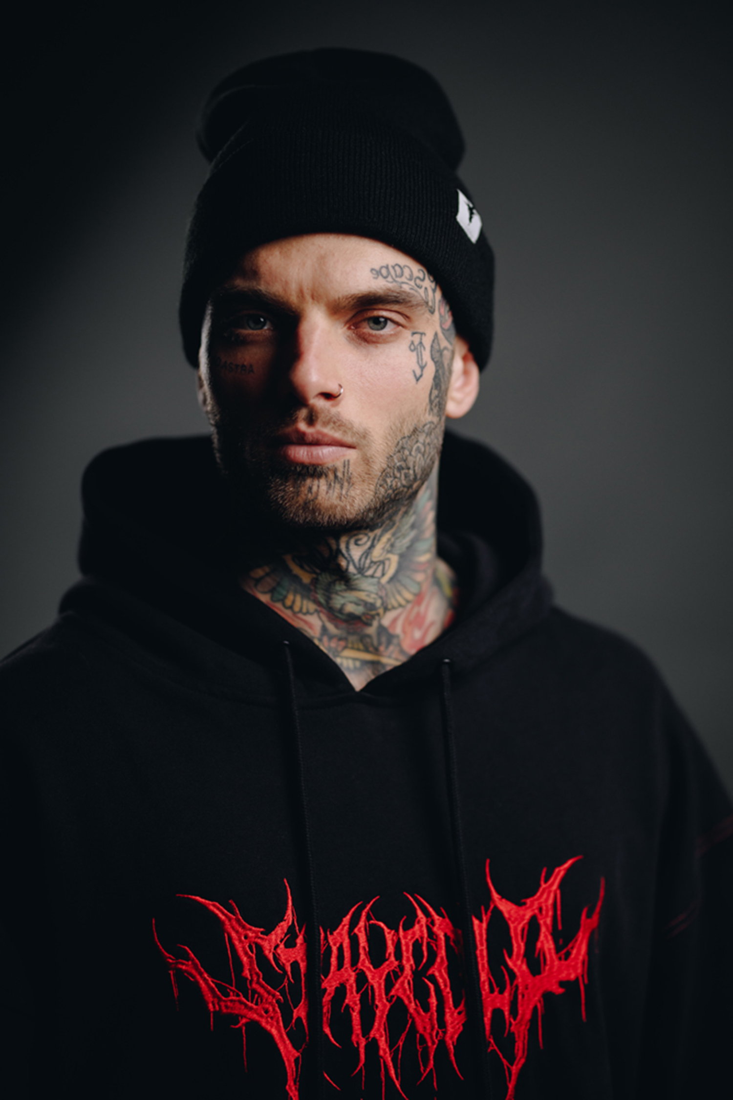 dark lettering, bloody style. Tattooed man. Clothing, Stay cold apparel, bloodshot