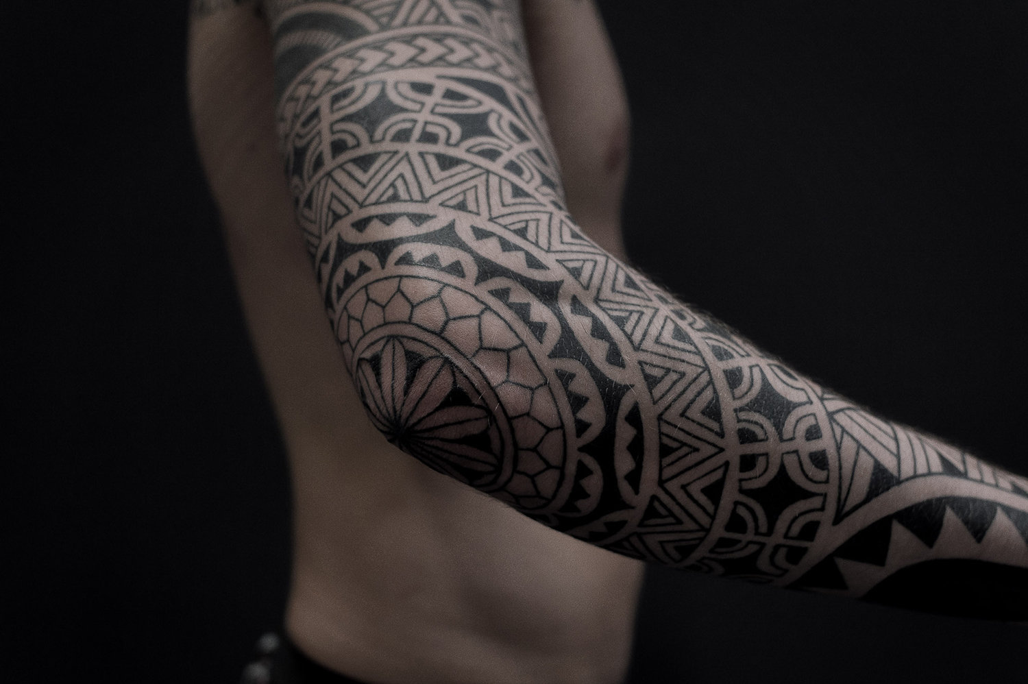 blackwork tattoo on arm, geometric shapes, neo-tribal by paradox